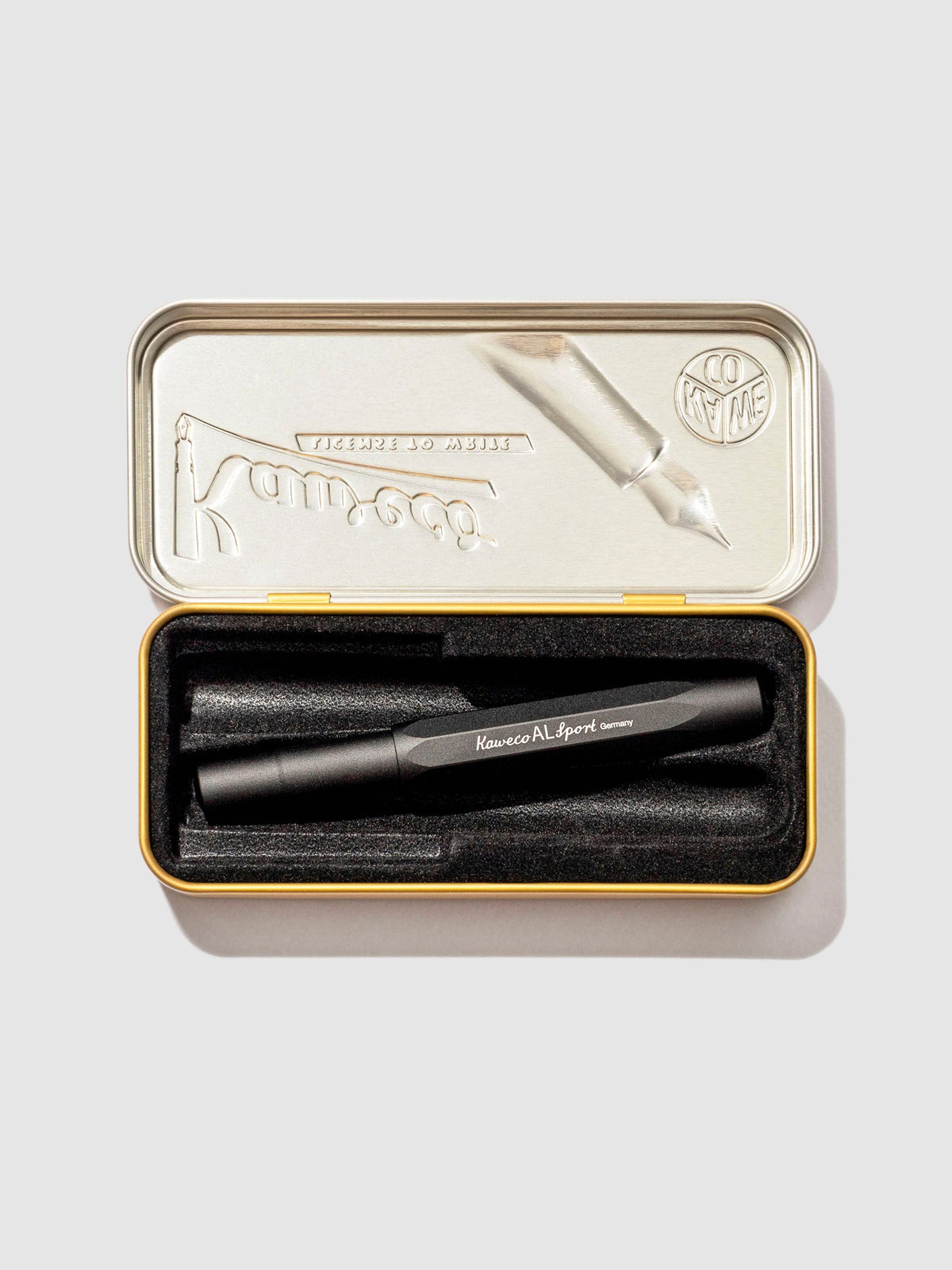 Kaweco AL Sport Fountain Pen, Black, Extra Fine Nib, Cloth and Paper. Pen displayed in its tin case on a neutral background.