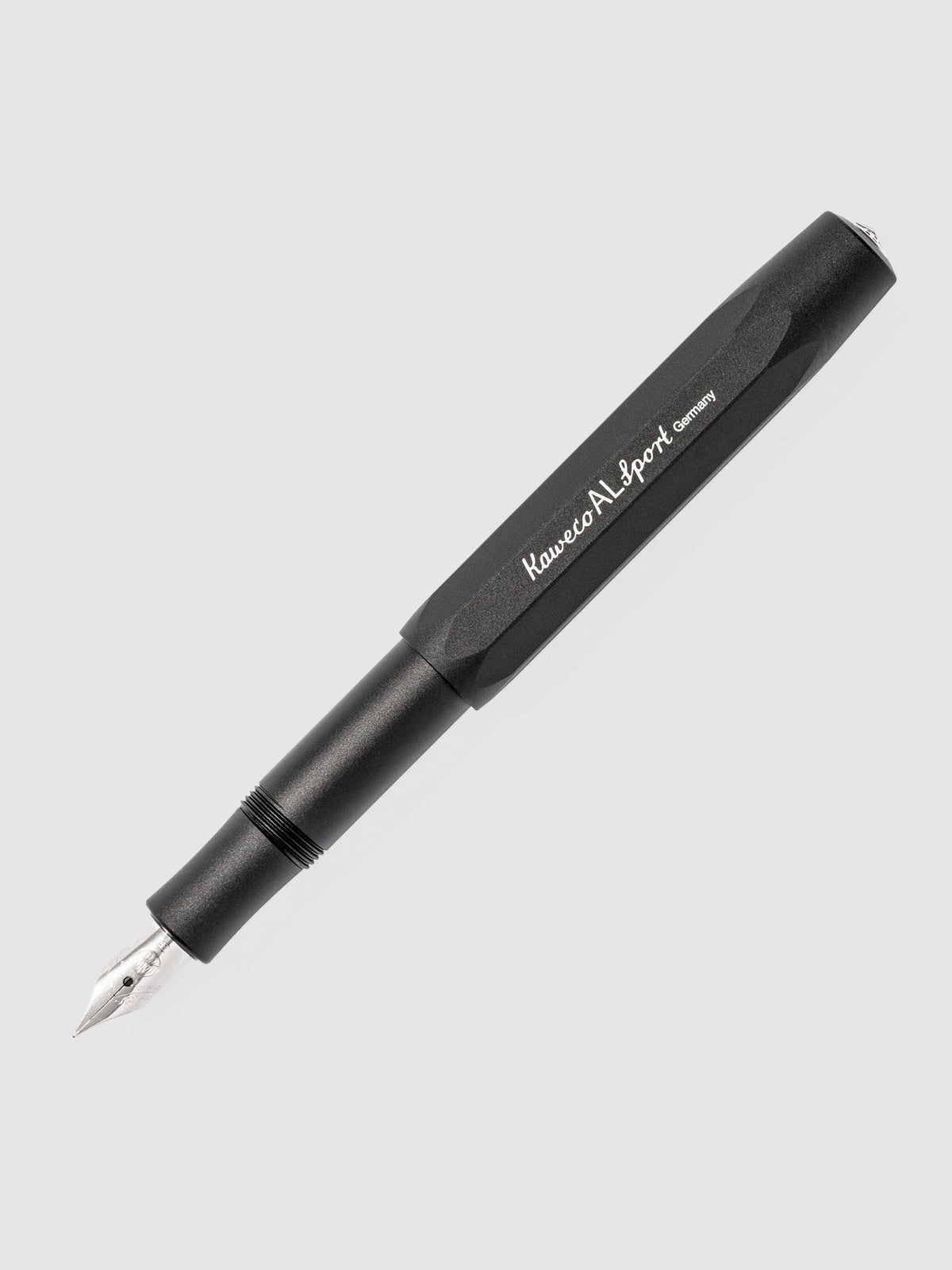 Black Kaweco pen displayed on a neutral background. The pen's nib is exposed.