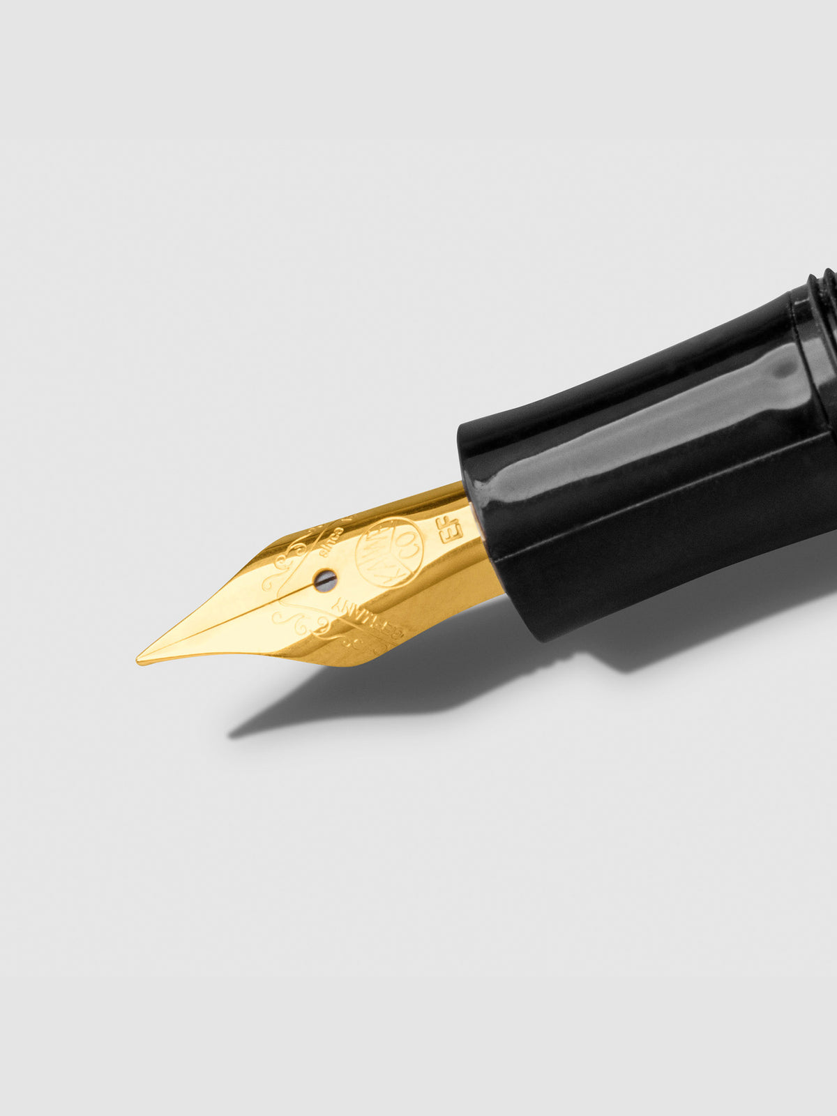 Gold extra fine nib displayed on a neutral background.