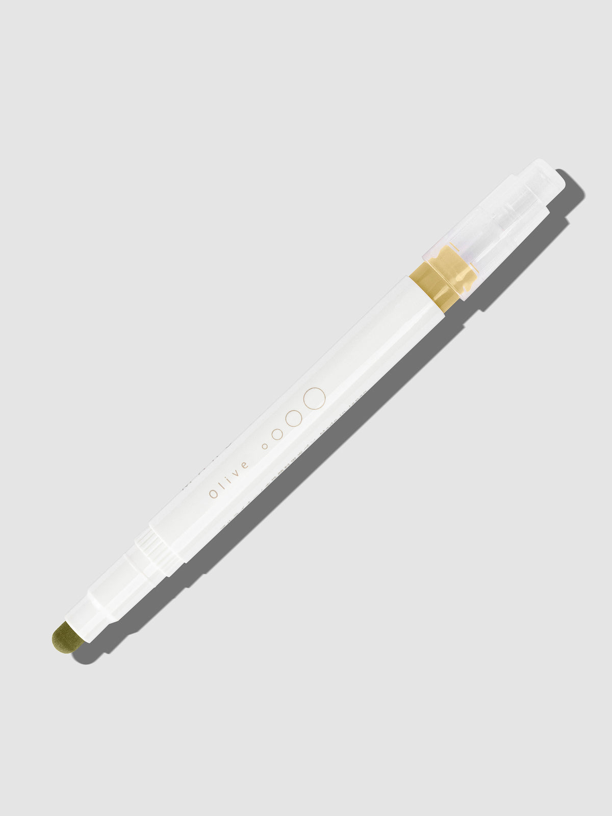 Olive highlighter with tip exposed and cap posted to the end of its barrel on a neutral background.