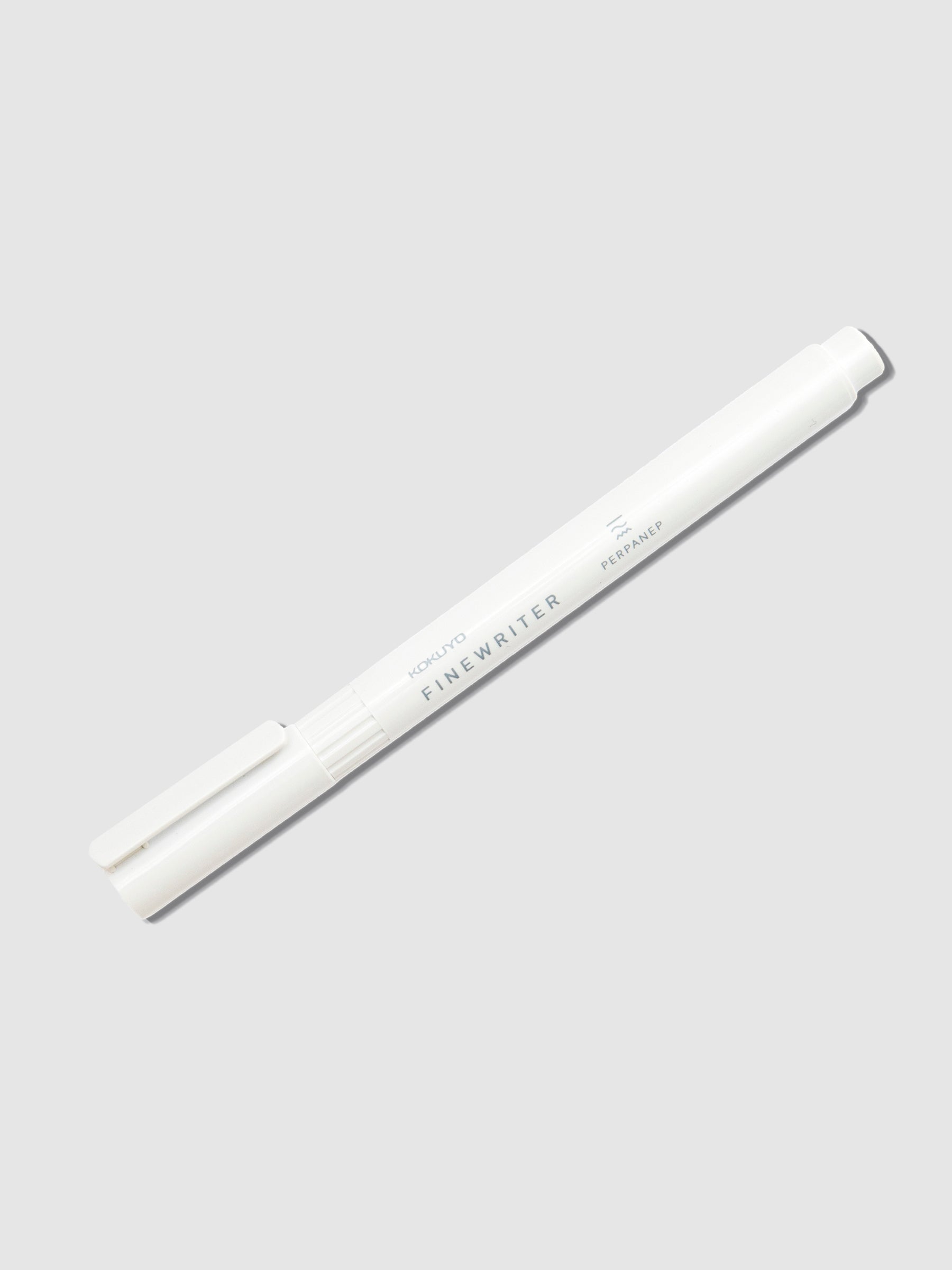 Kokuyo Perpanep Finewriter Pen, 0.35 mm, Black, Cloth and Paper. White pen with cap on displayed on a neutral background. 