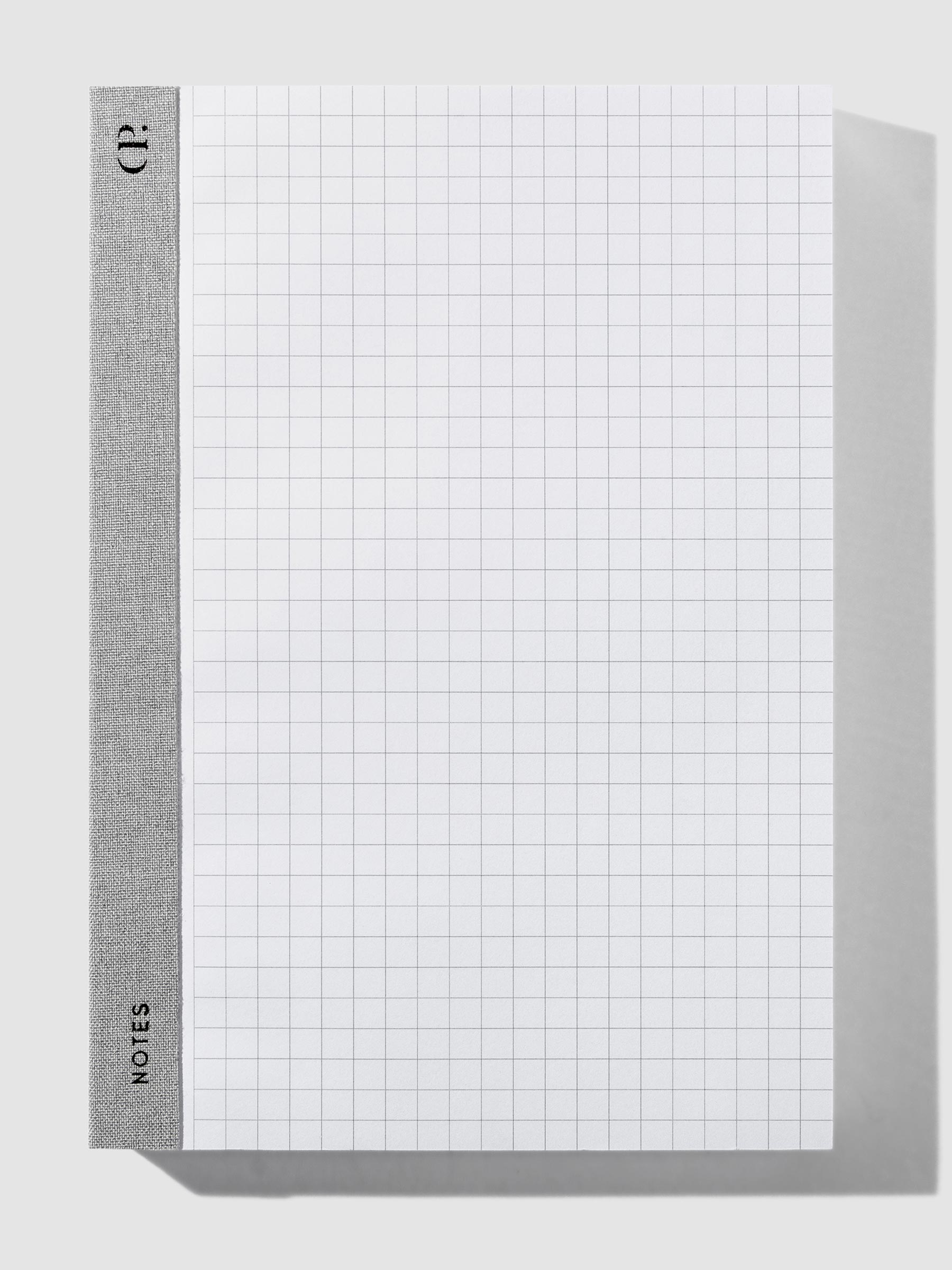 Left Bound Graph Notepad, A5, Cloth and Paper. Notepad positioned vertically on a neutral background. 