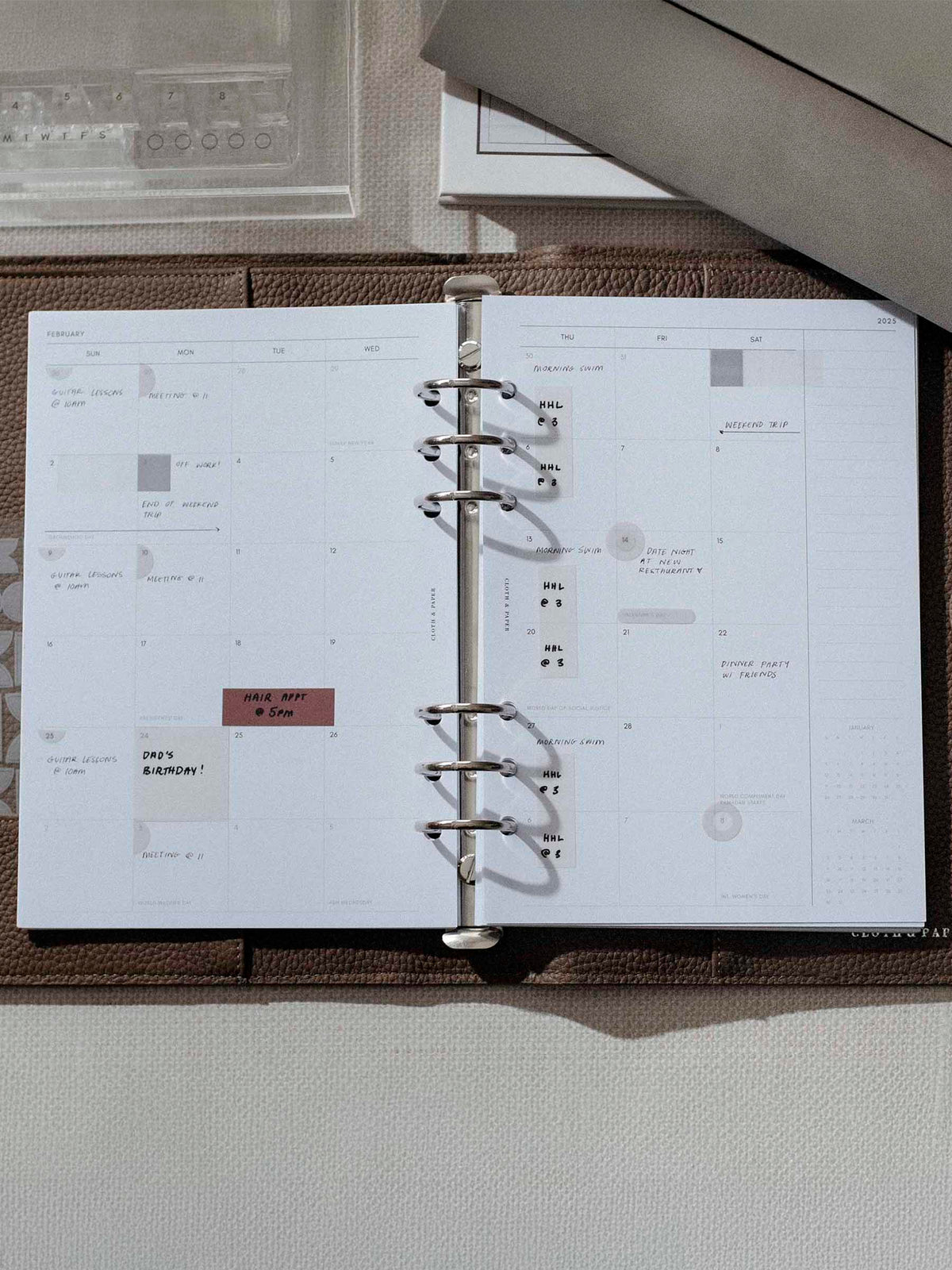 Matchstick Page Flag use inside a brown leather planner.