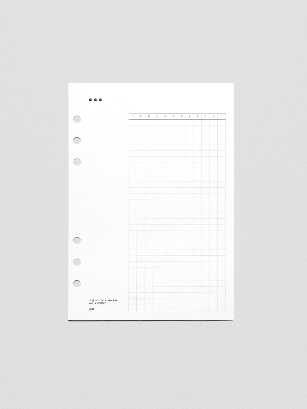 White cardstock planner dashboard with 3 dot design, habit tracker, and text design printed in black.