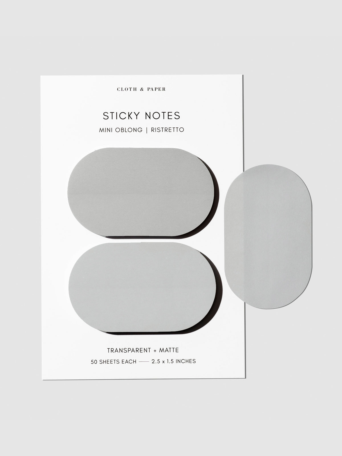 Sticky notes displayed on their backing on a neutral background. One sticky note has been removed and attached to the side of the backing to show its transparency.