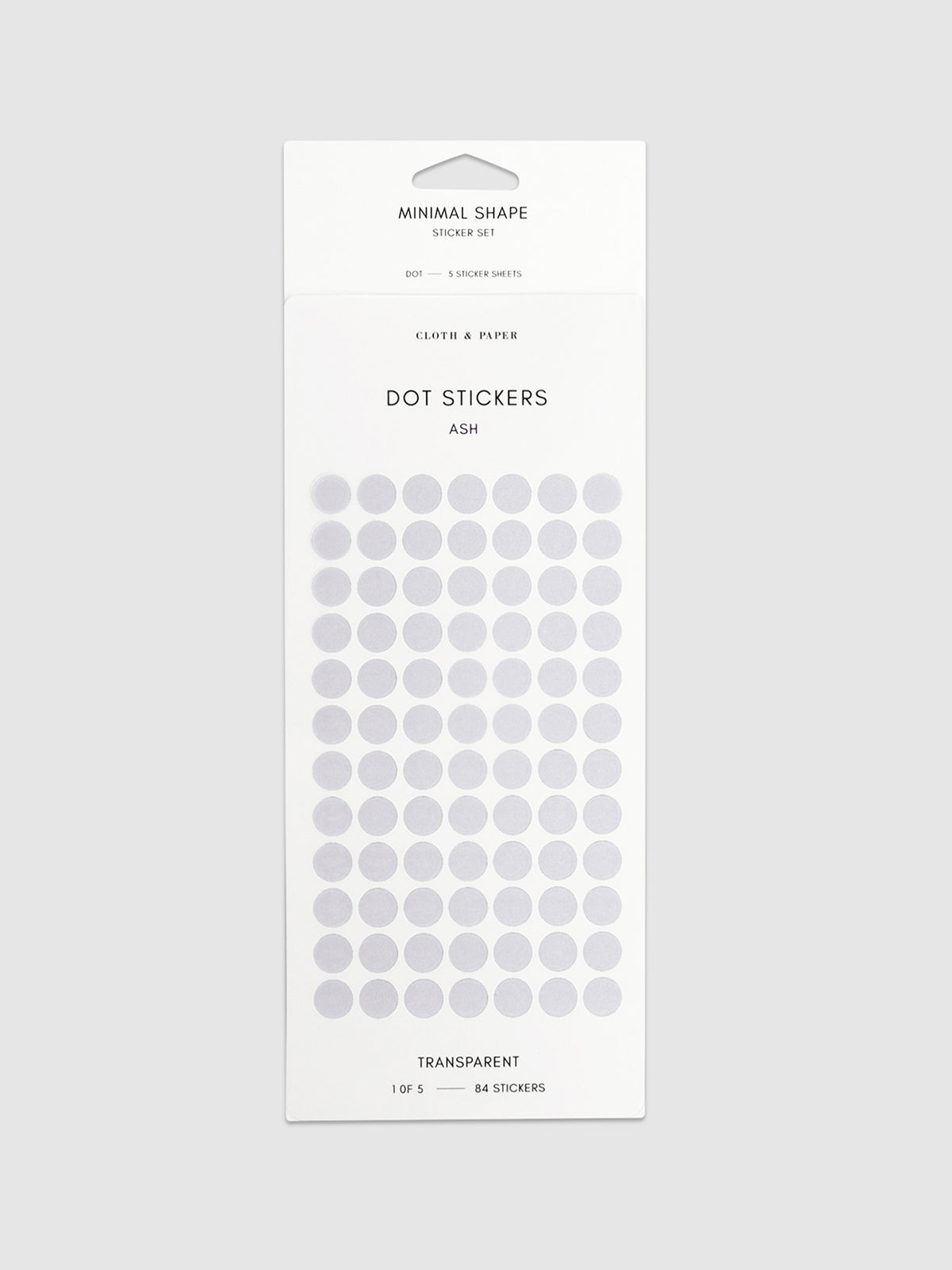 Minimal Shape Sticker Set, Transparent Dots, Ash, Cloth and Paper. Dot stickers in their packaging on a neutral background.