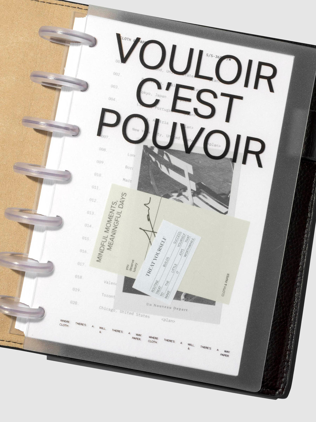 Moments Cover and Dashboard displayed in black folio with clear discs turned at a slight angle on a neutral background.