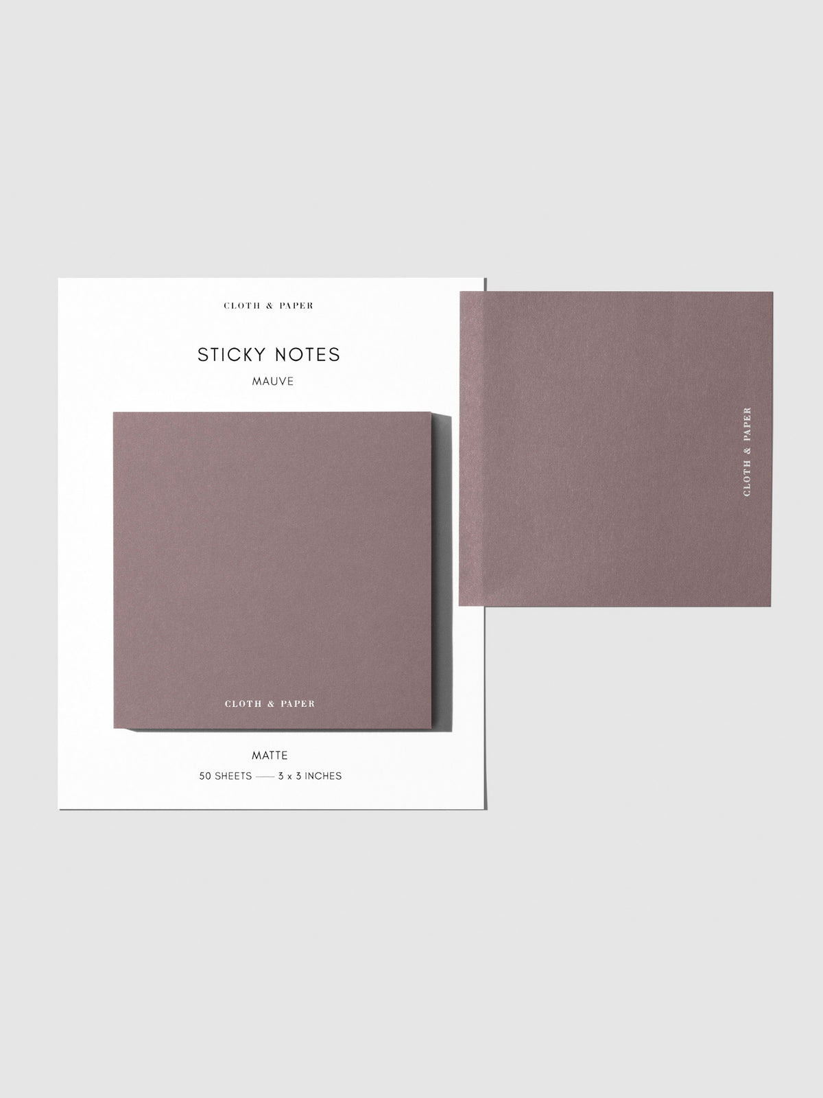 Sticky note set displayed against a neutral background. One note is placed on the packaging's edge. Color shown is Mauve.