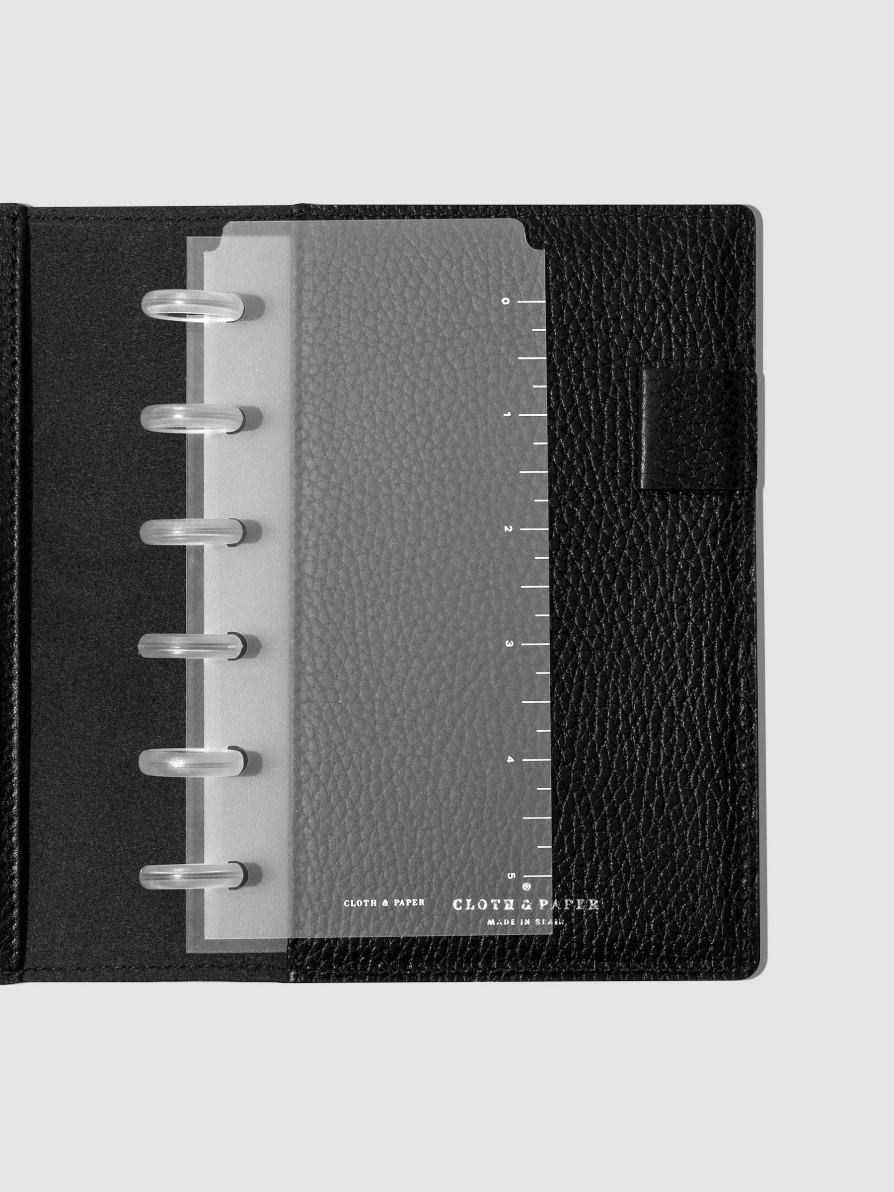 Page marker in use inside a black leather folio.