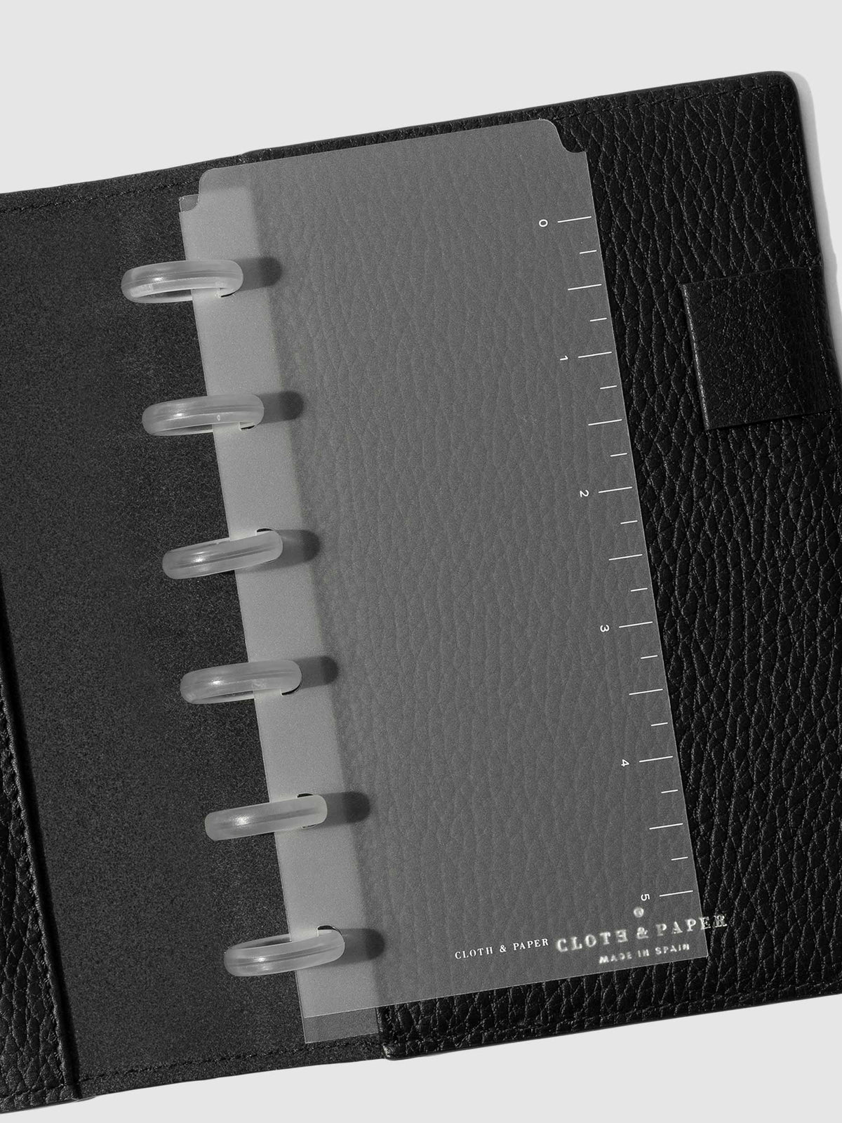 CP Petite page marker displayed inside a black leather folio.