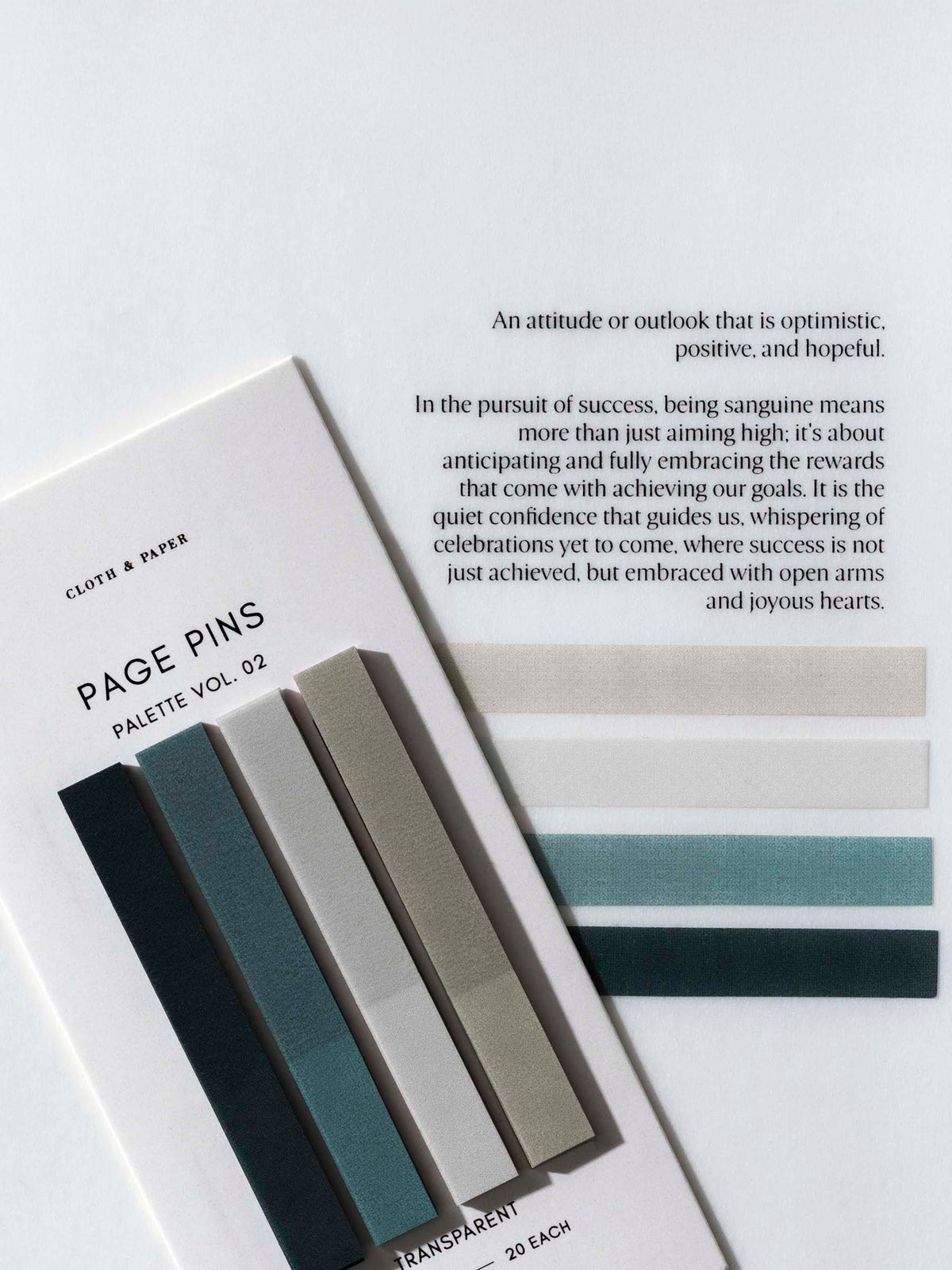 Page Pins Vol 02 on their backing tilted slightly to the left, layered on top of the Sanguine Dashboard quote with one of each of the page pins adhered to the dashboard