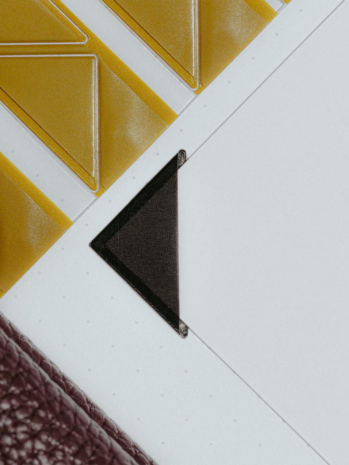 Photo corners shown in use inside a planner insert.