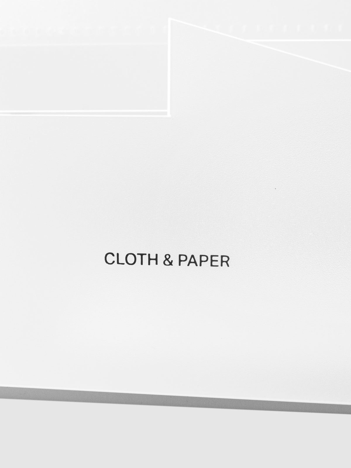 Closeup of Cloth and Paper logo printed on caddy.