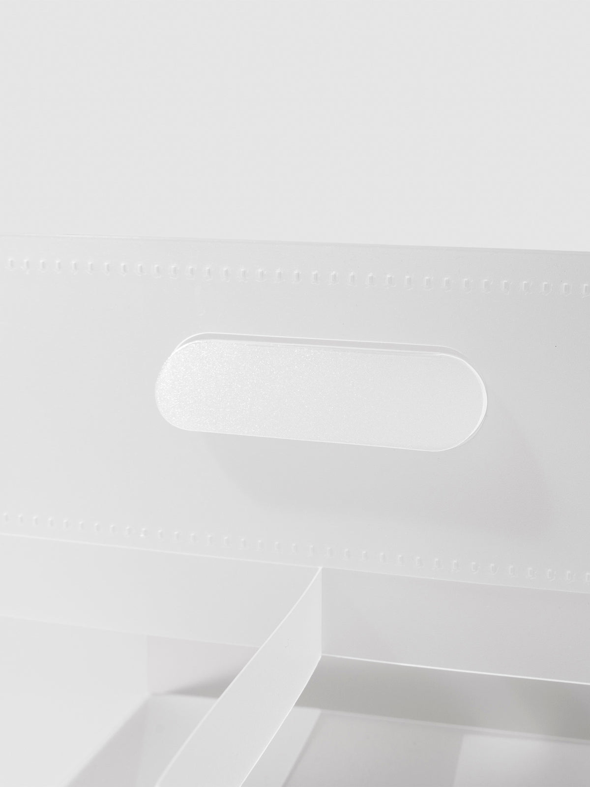 Closeup of carrying handle on storage caddy.