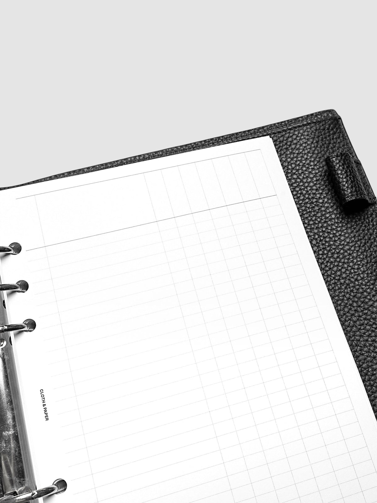 Close up of the Inbox Sorting Planner Inserts shown pre-punched for 6-Ring A5 planners in a black agenda.