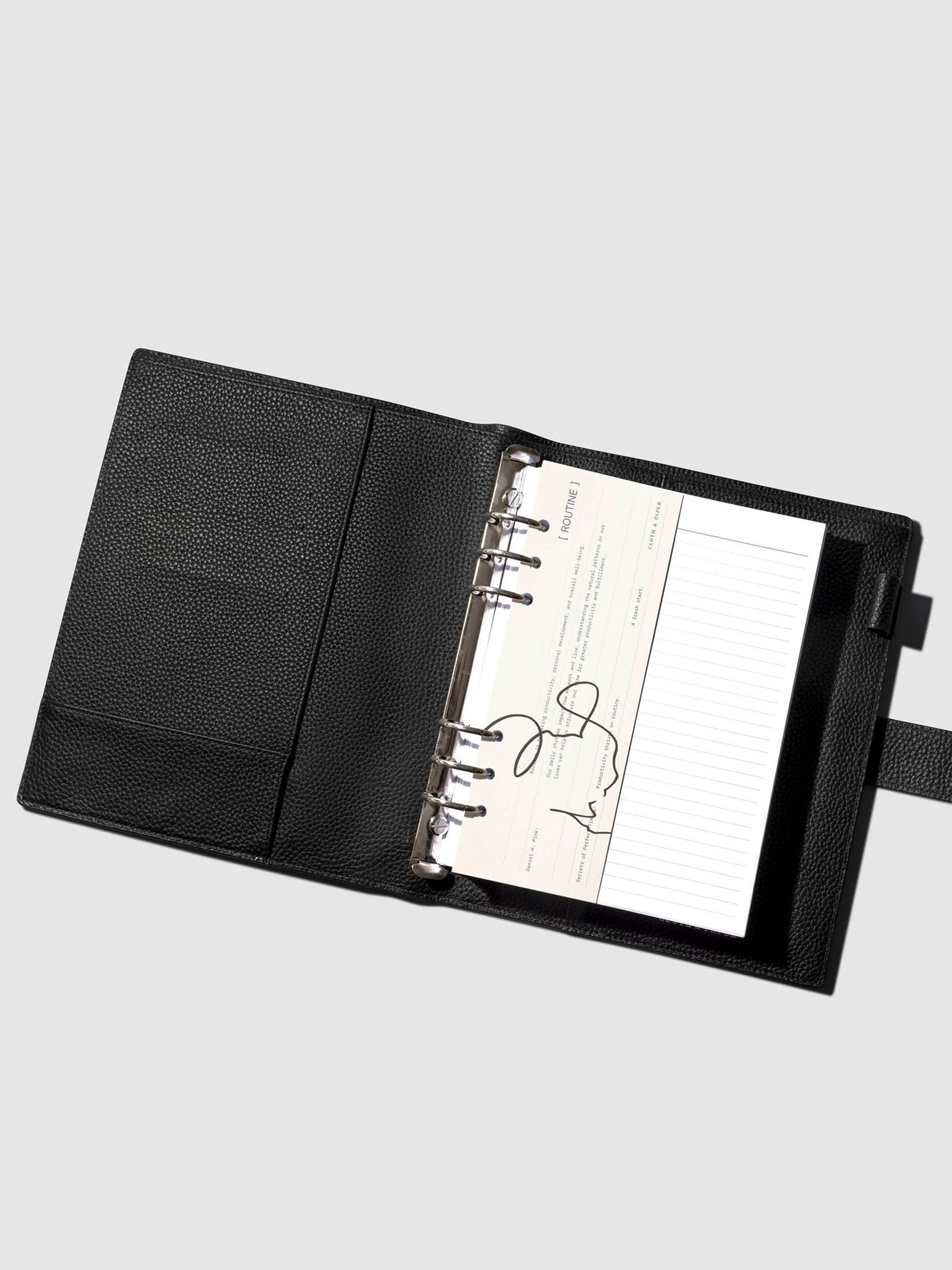 Dashboard shown in use inside a black leather planner.