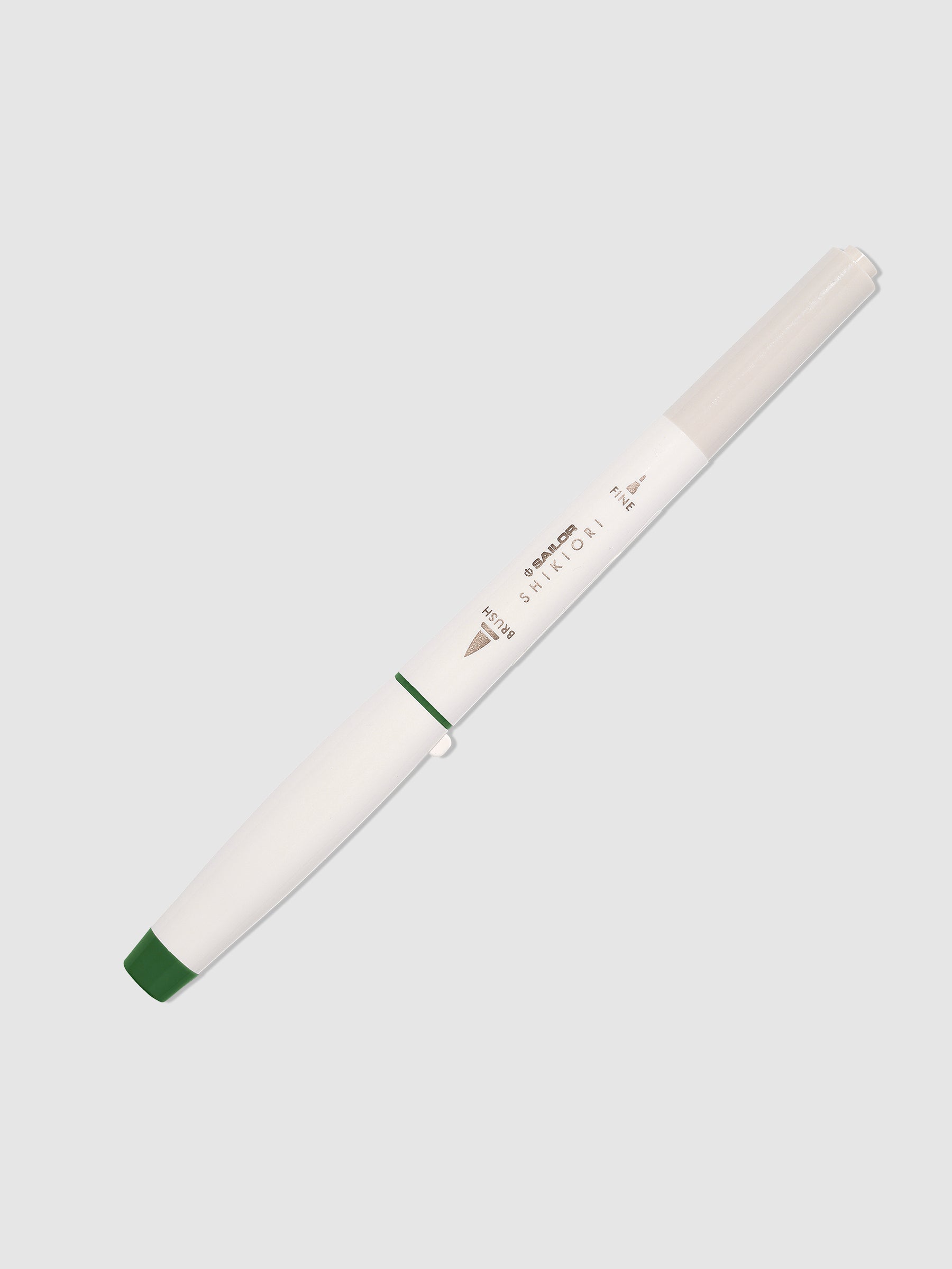 Brush pen displayed on a neutral background. Color pictured is Tokiwamatsu.  