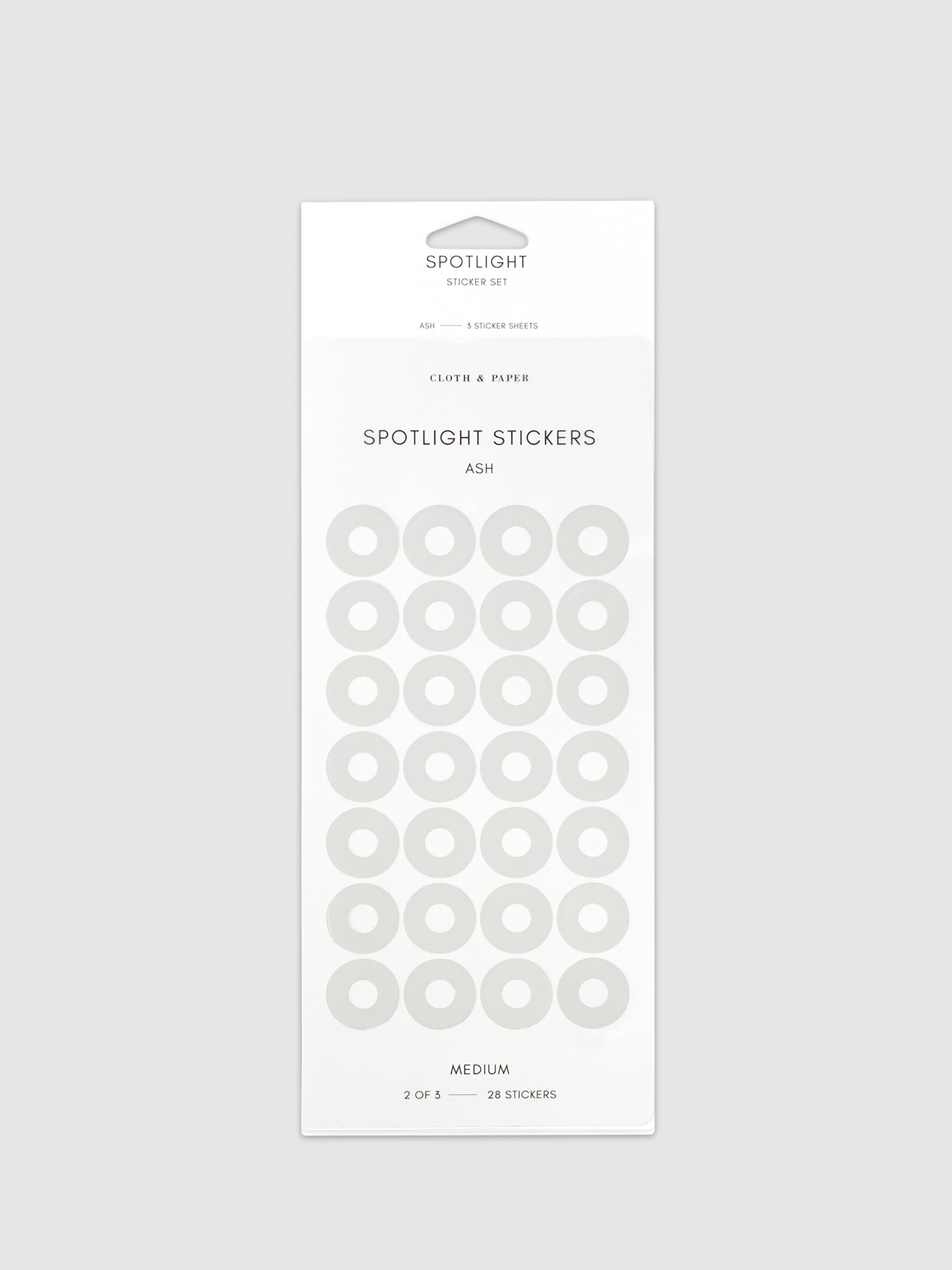 Medium sticker in its packaging displayed on a neutral background. Pictured color is Ash.