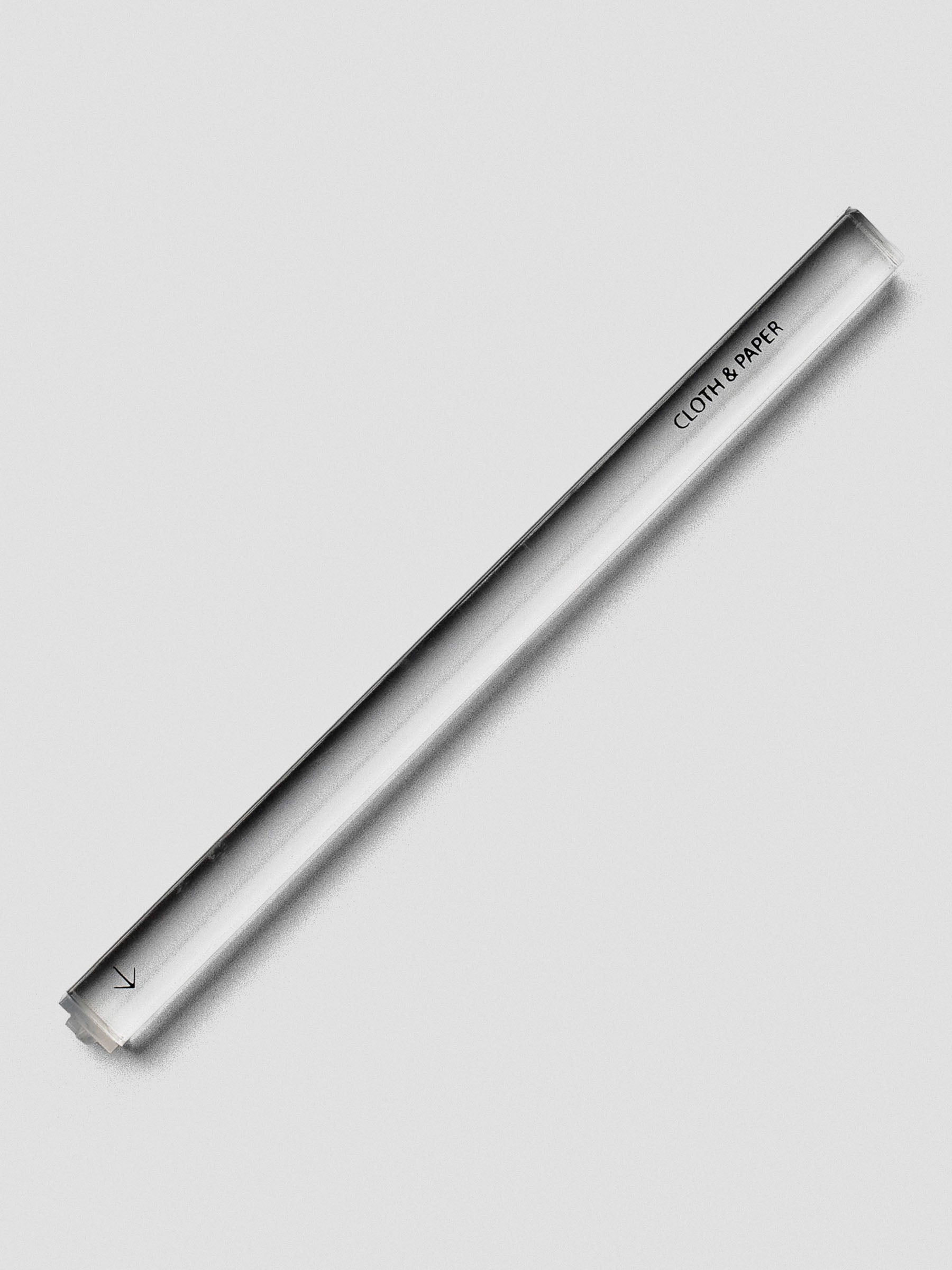 Single clear acrylic stamp stick with an arrow icon on the end and the Cloth & Paper logo on the side.