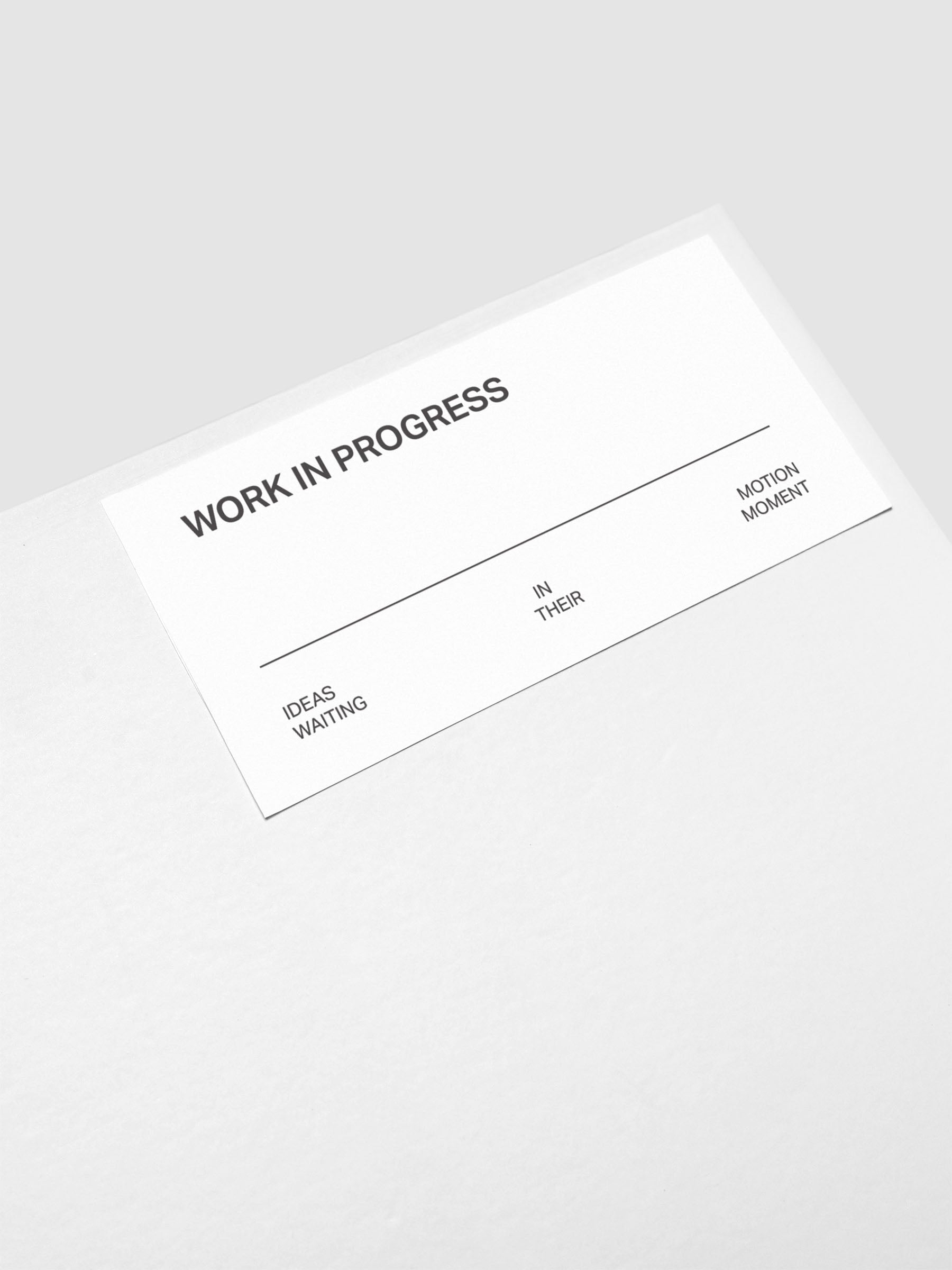 Close up of the Work In Progress label sticker applied to the exterior of the Storage Book 4.0.