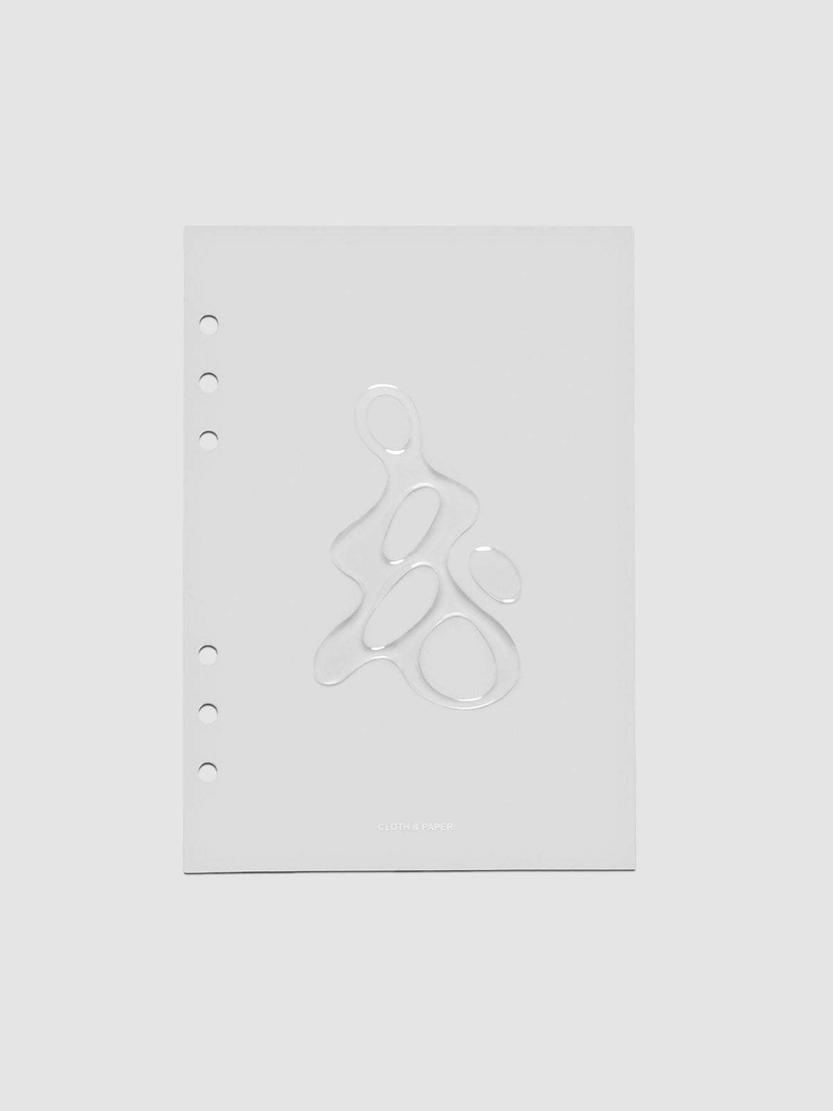 Light grey, semi-transparent, and glossy plastic planner dashboard with organic raised shape design in size A5 on a neutral background.