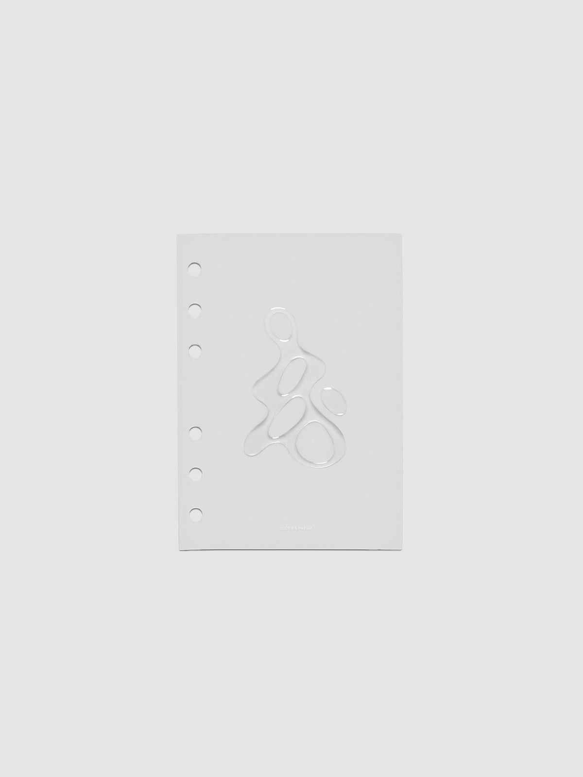 Light grey, semi-transparent, and glossy plastic planner dashboard with organic raised shape design in size A6 on a neutral background.