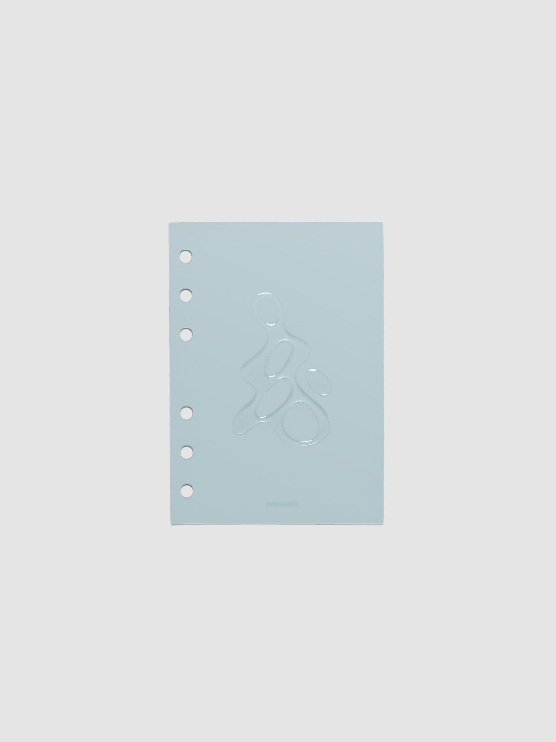 Light blue, semi-transparent, and glossy plastic planner dashboard with organic raised shape design in size A6 on a neutral background.