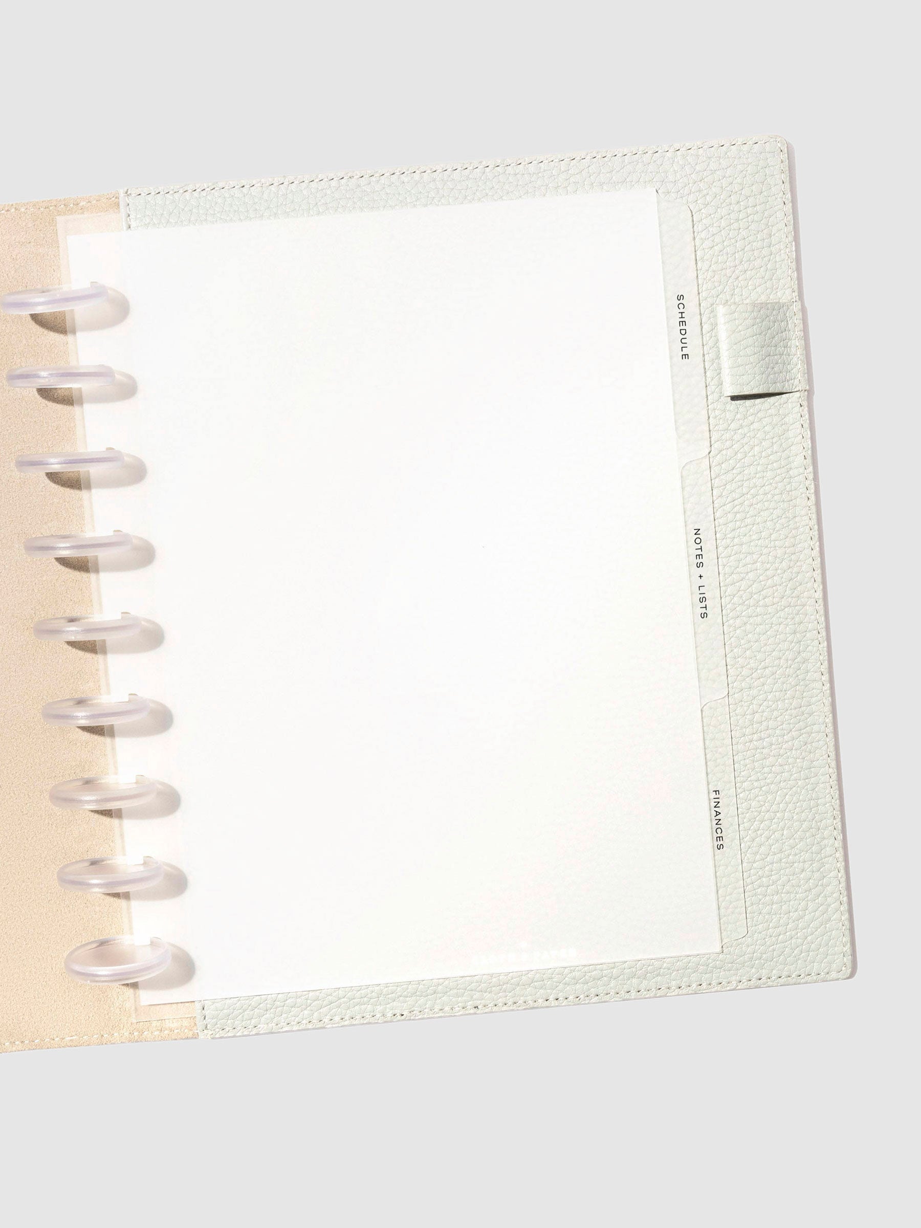 Black foil tabs displayed in use inside a  leather folio.