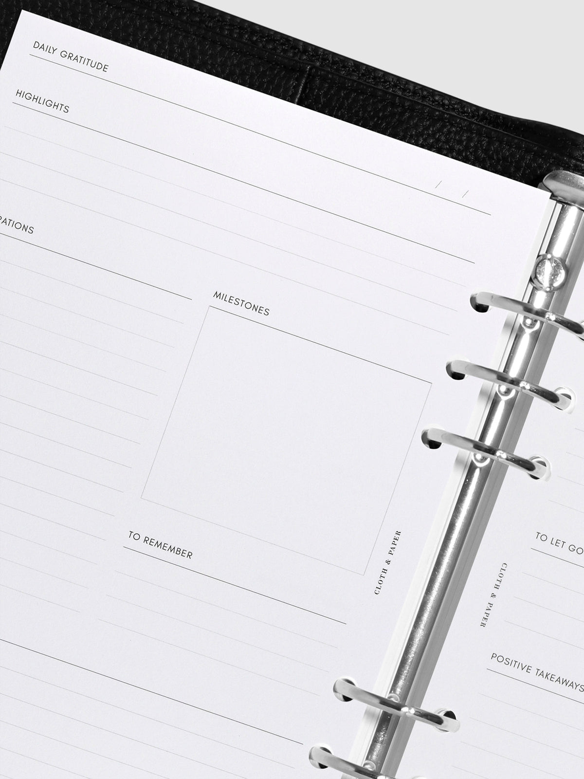 Closeup of inserts inside black leather agenda.