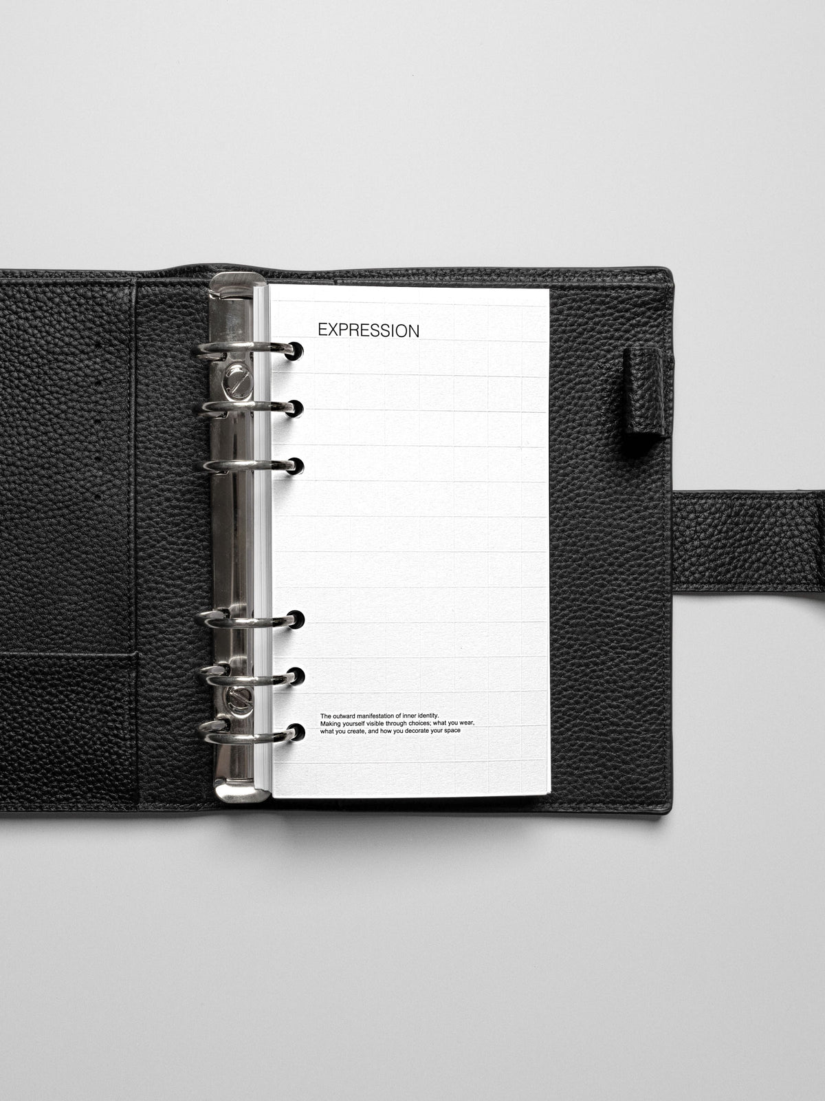 Personal size planner open to the Tile Planner Dashboard, providing a blank grid space for adding Square Stickers or notes.
