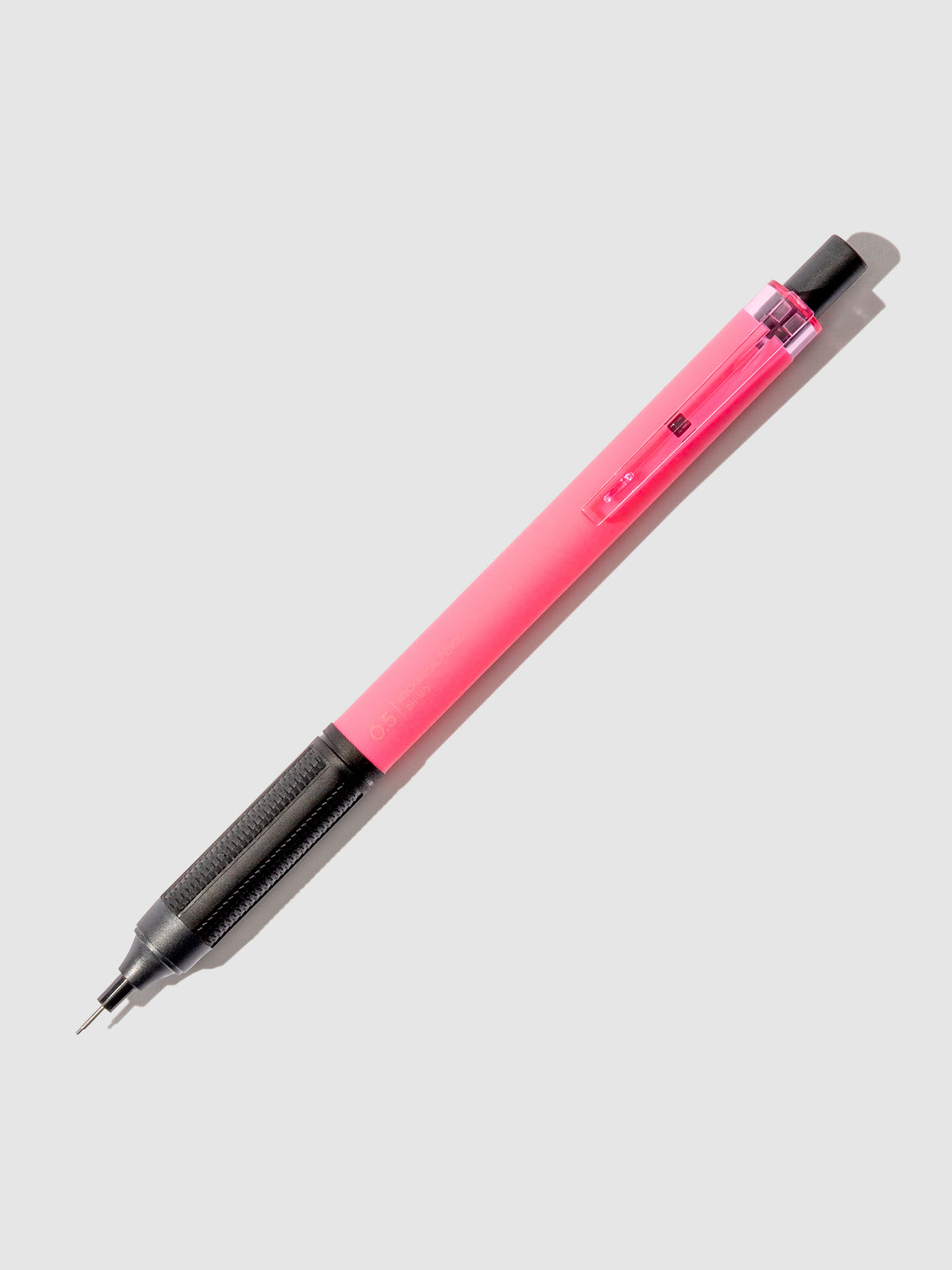 Neon pink pencil displayed on a neutral background.