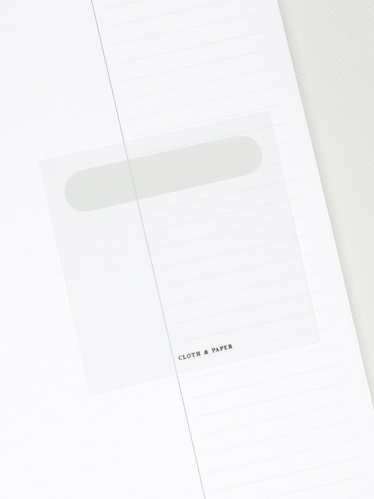 One Ash sticky note placed in an insert to show its transparency. 