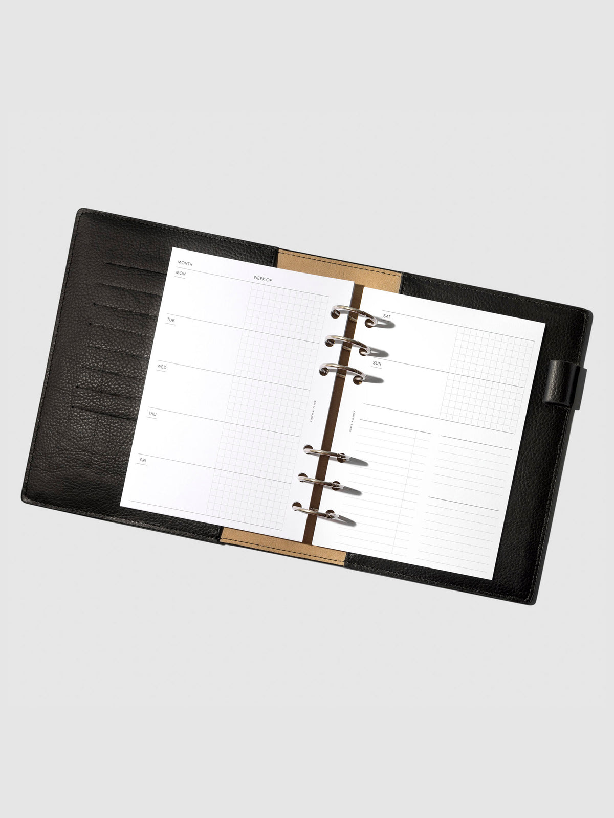 Undated Horizontal Weekly Inserts in use inside a black leather planner.