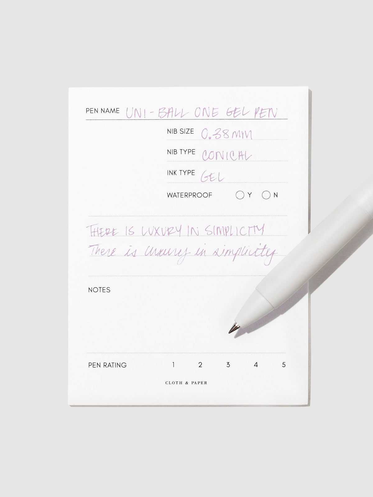 Pen tilted slightly to the right on a neutral background. Color pictured is Plum Purple.