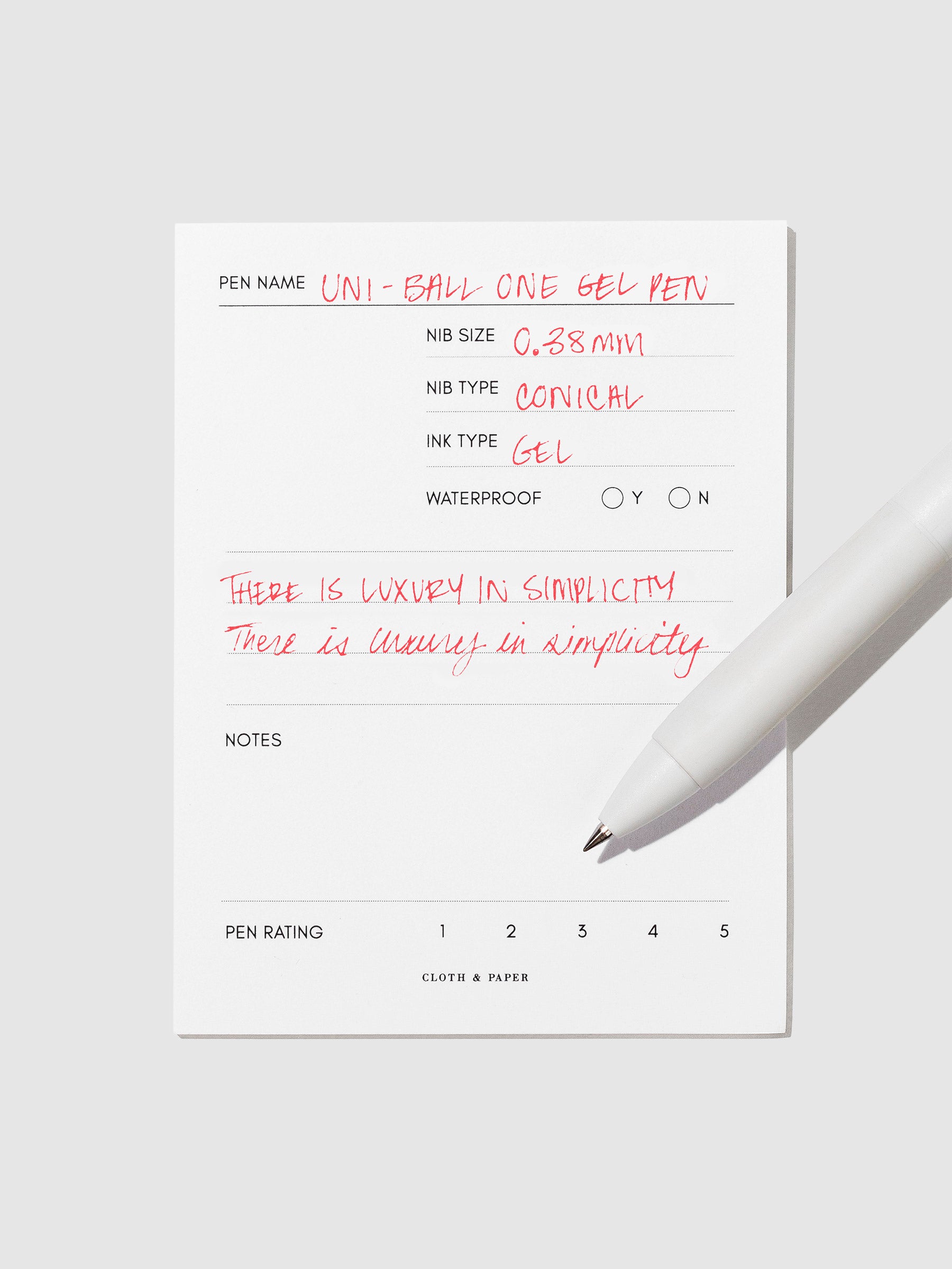 Pen tilted slightly to the right on a neutral background. Color pictured is Red.