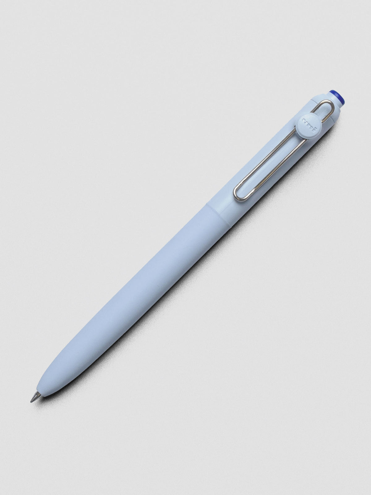 Blue pen shown at an angle with a silver clip.