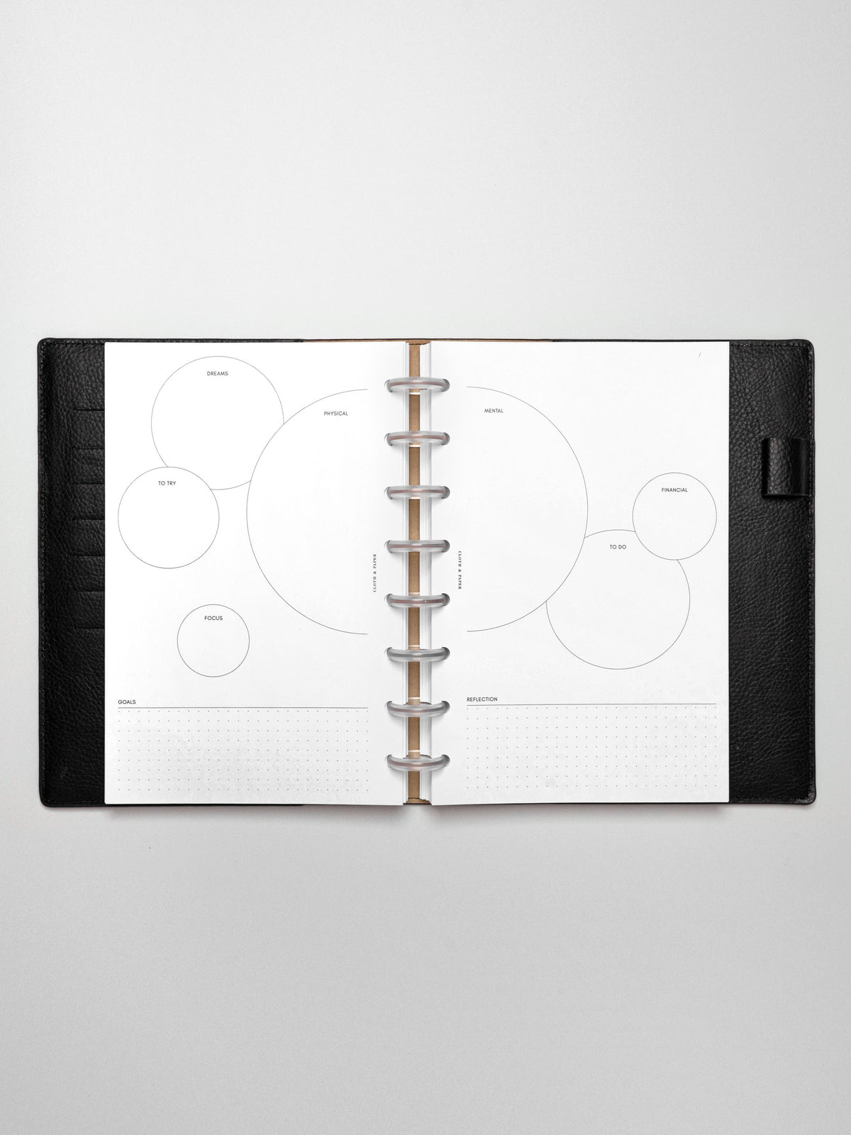 Insert in use inside a black leather planner.