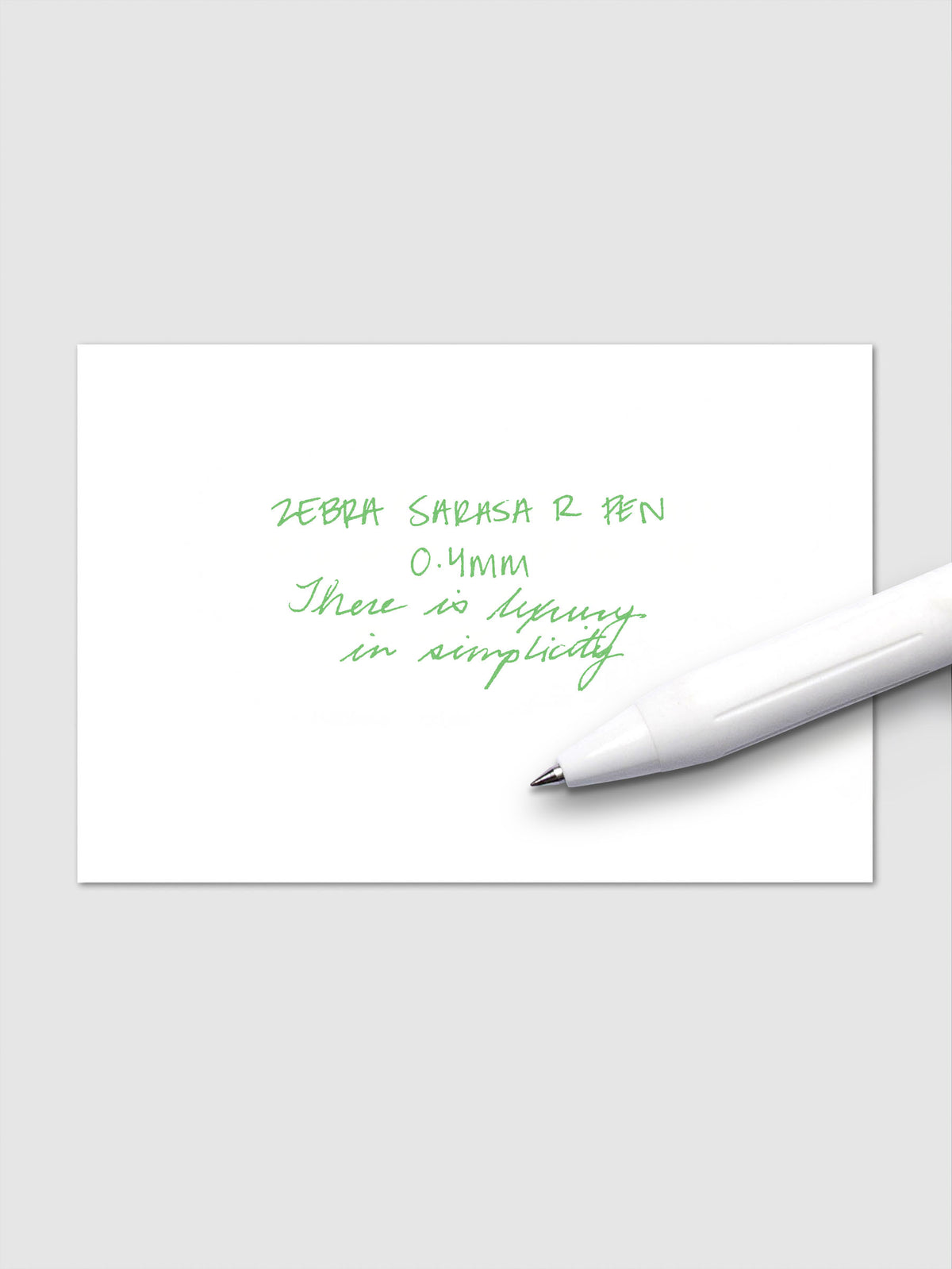 Writing sample using Zebra Sarasa R 0.4mm pen in fresh green ink on white paper.