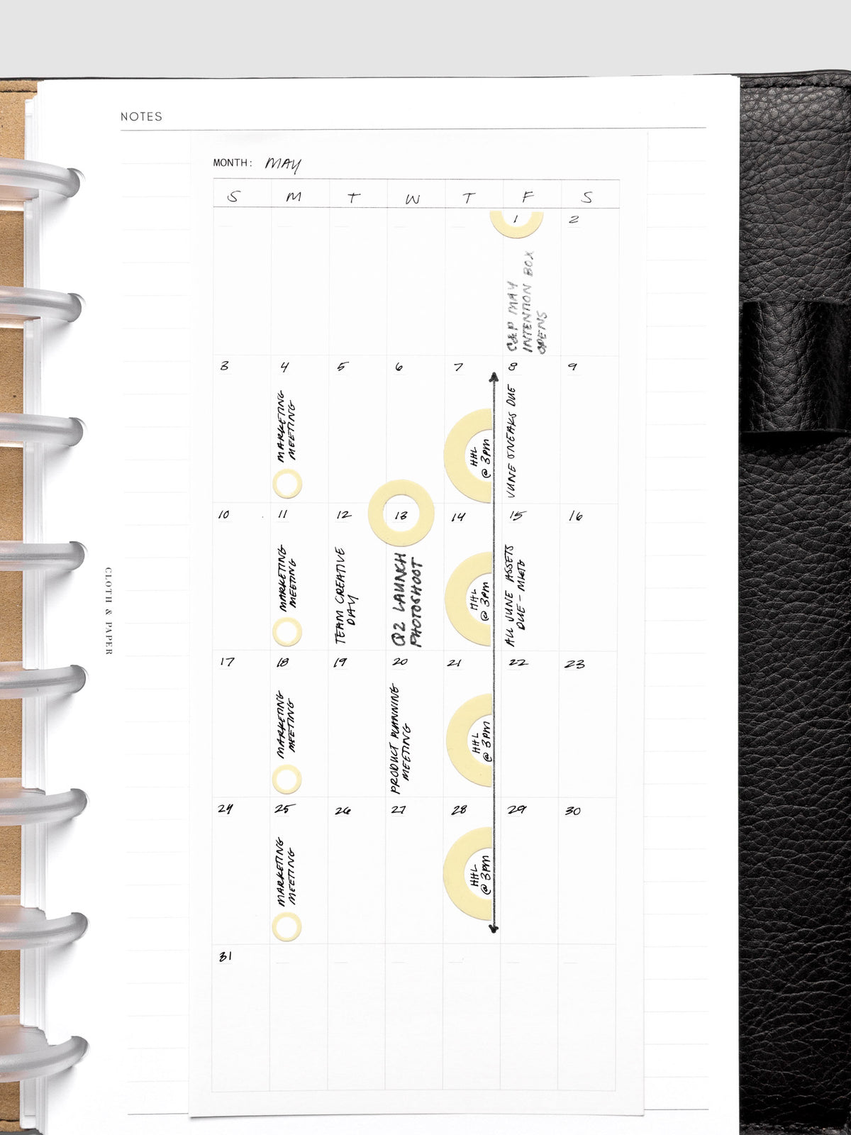 Detail view of the calendar monthly overview large sticky notes with stickers and handwritten notes applied