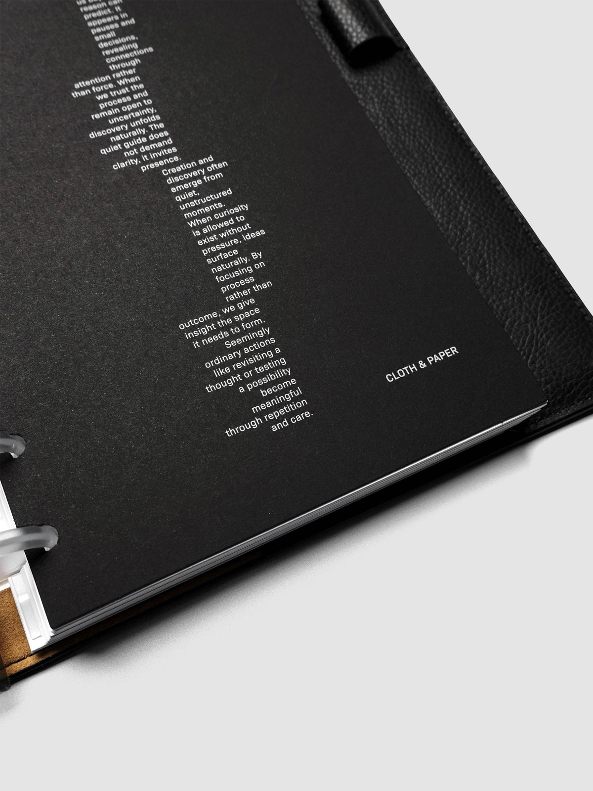 Detail view of the black Intuition Ultra Thin Planner Cover + Dashboard Set.
