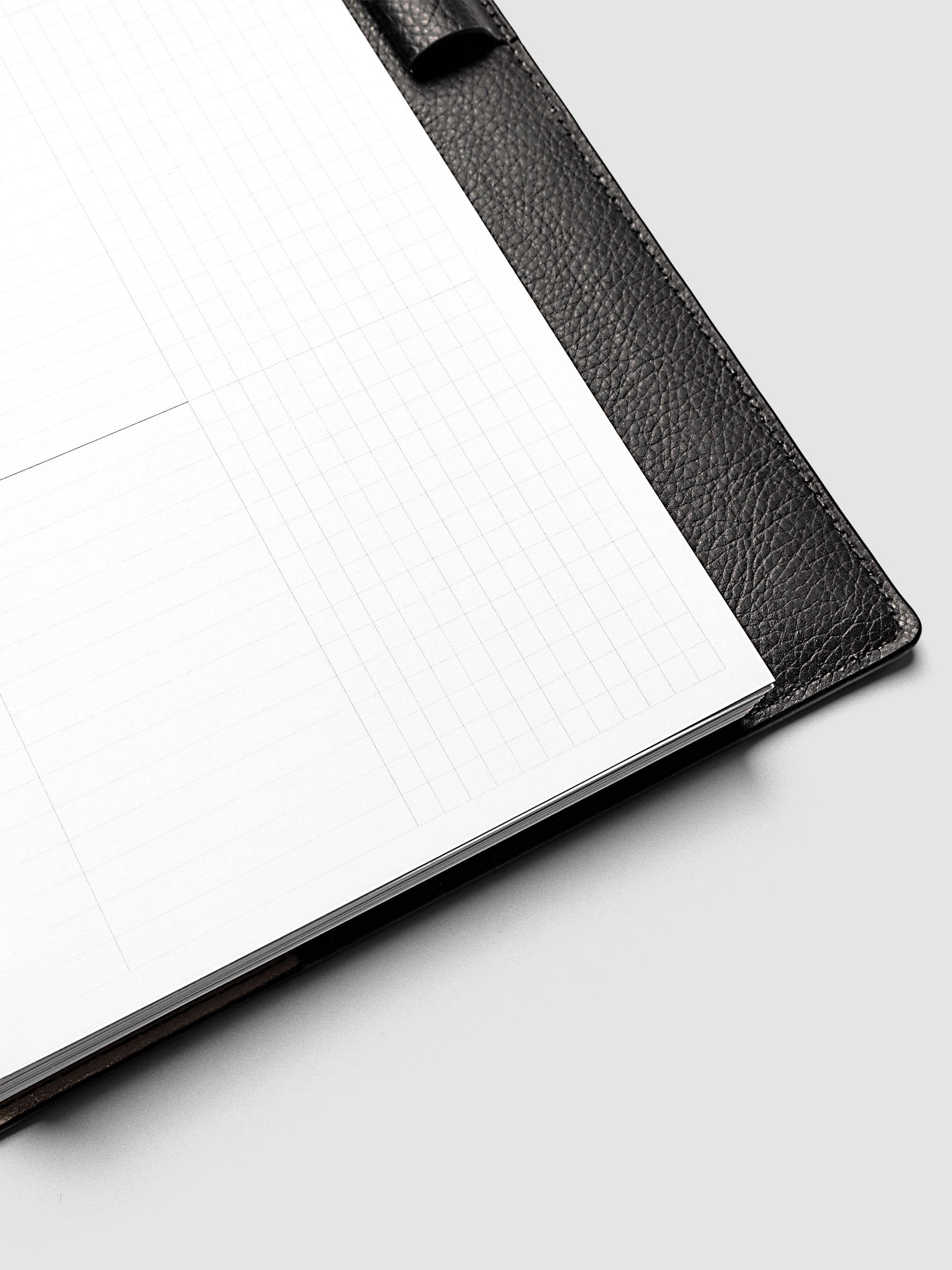 Daily Workflow Planner Inserts, Half Letter 8-Disc Punch, close-up of the bottom of the blank right page showing the graph layout inside a planner