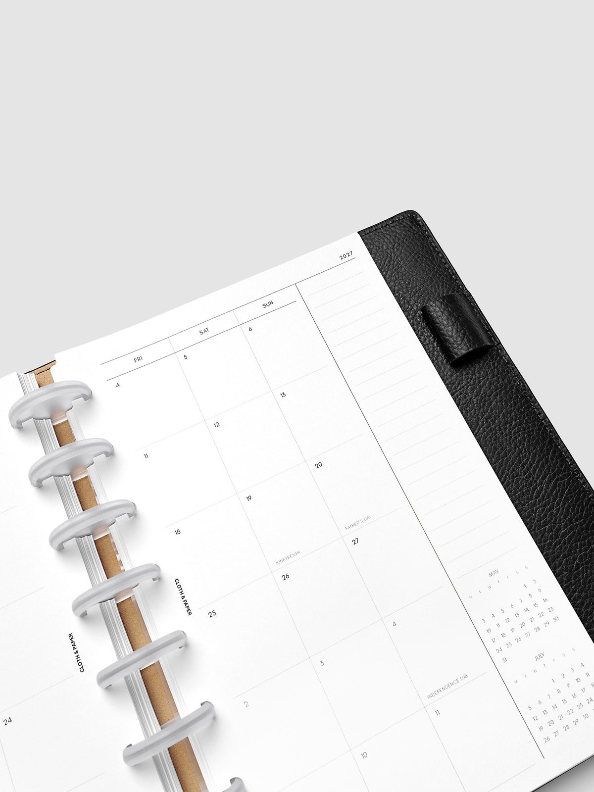2027 Dated Monthly Planner Inserts, Monday Start, Half Letter 8-Disc Punch, close-up detail of right page monthly calendar with notes column along the far right shown inside a planner