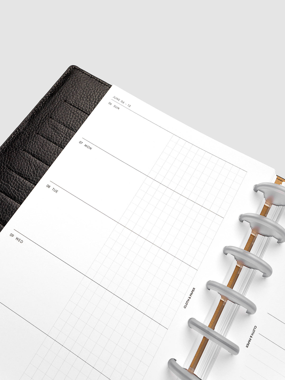 2027 Dated Weekly Horizontal Planner Inserts, Sunday Start, Half Letter 8-Disc Punch, close-up of the top of the left page showing Sunday through Thursday with each day split into open and graph columns