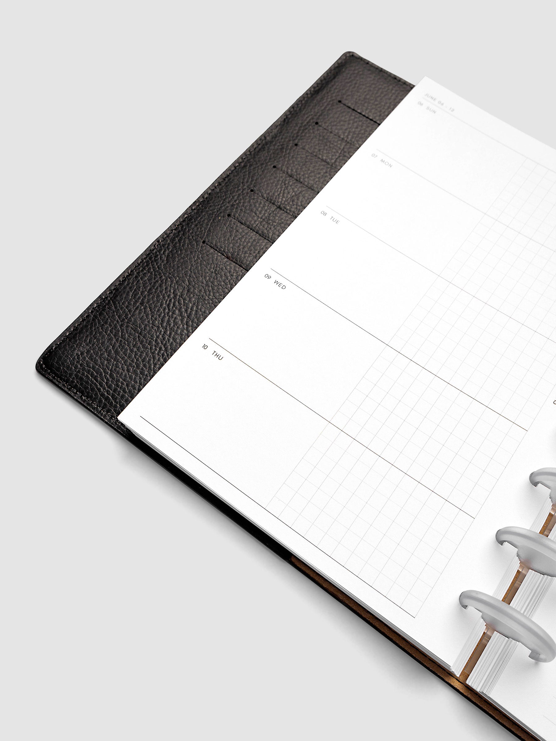 2027 Dated Weekly Horizontal Planner Inserts, Sunday Start, Half Letter 8-Disc Punch, close-up of the bottom of the left page showing the lower portions of the Sunday through Thursday daily columns