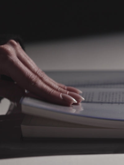 A video showcasing the Cloth & Paper collection — hands gliding through planners, journaling, and stamping pages with intention.