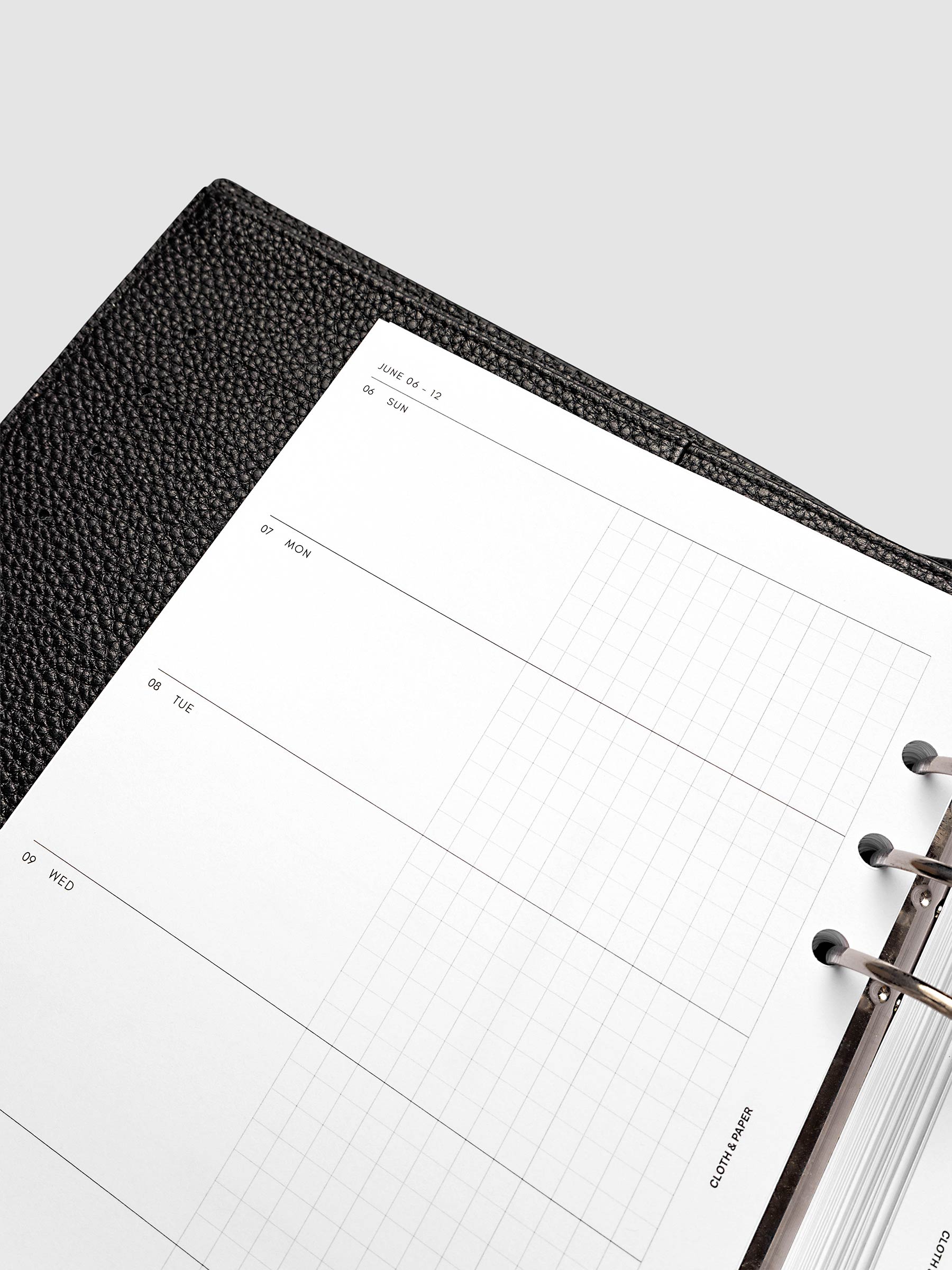 2027 Dated Weekly Horizontal Planner Inserts, Sunday Start, A5 6-Ring Punch, close-up of the top of the left page showing Sunday through Thursday with each day split into open and graph columns